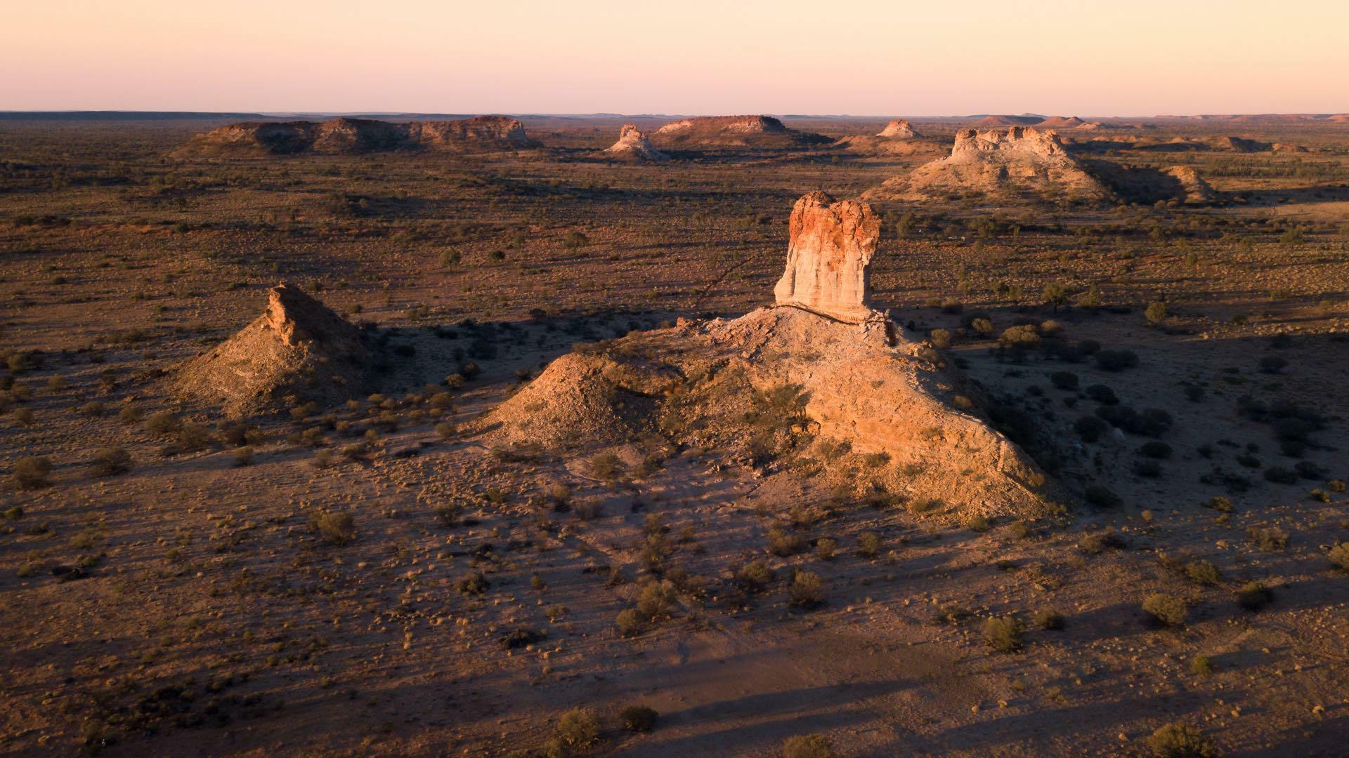 Outback Camping at Chambers Pillar, Conor Moore, desert, drone shot, sunset, rocks, pillars