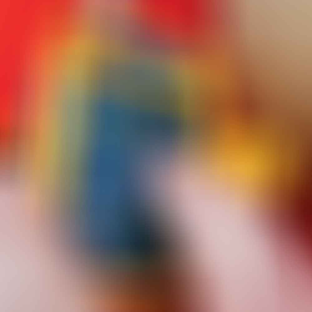A hand holding a small camera