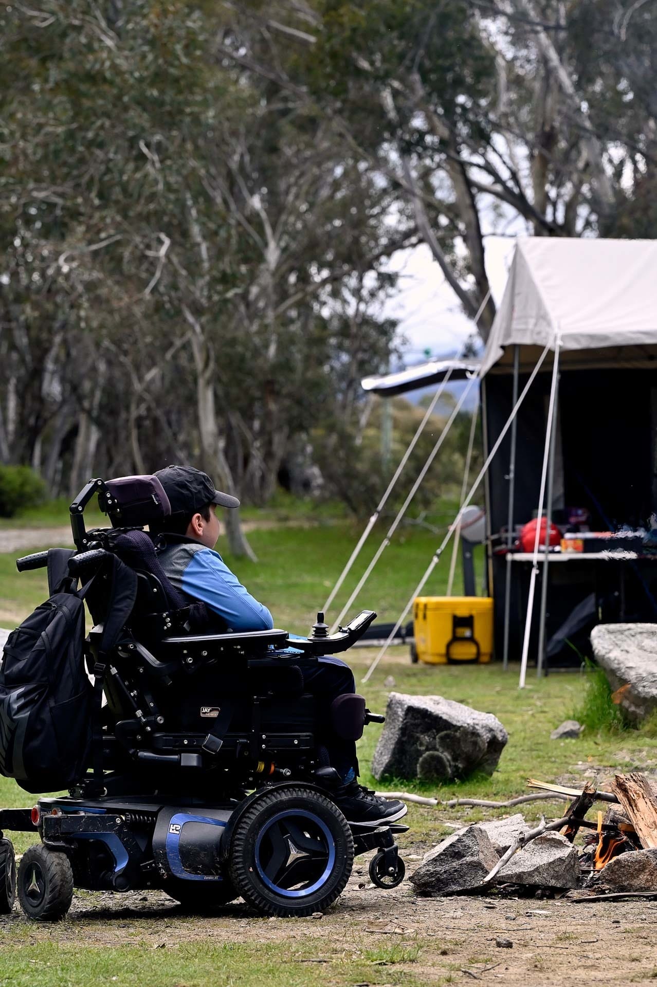 Josh chilling by the fire, 4 Ideas for Accessible Adventures in NSW, joe kennedy,a