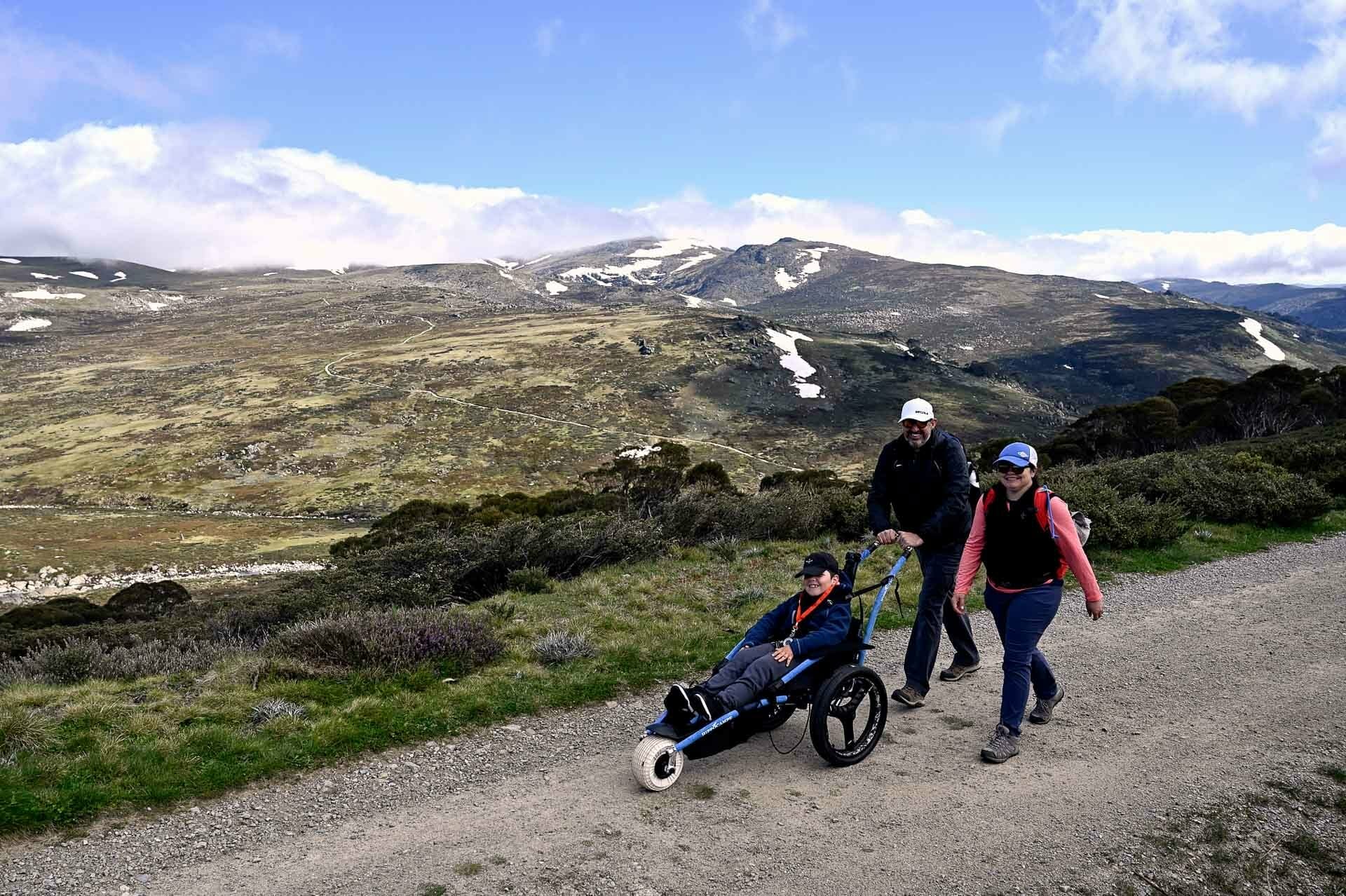 Josh on the trail with his mum and dad, 4 Ideas for Accessible Adventures in NSW, joe kennedy, kosciuszko national park, summit track