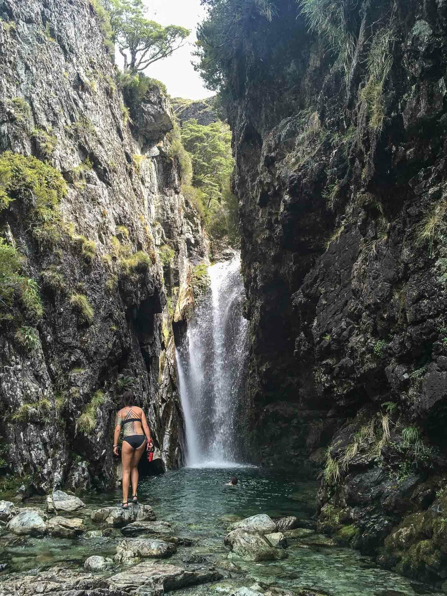 How To Squeeze Three of New Zealand’s ‘Great Walks’ Into Under Two Weeks, Bree Townsend, Routeburn Track, Routeburn Falls, waterfall, swimming hole, woman