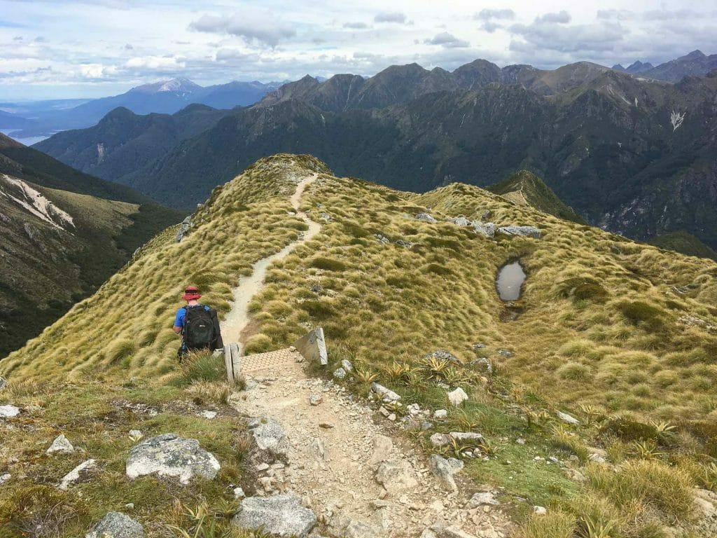 How To Squeeze Three of New Zealand’s ‘Great Walks’ Into Under Two Weeks, Bree Townsend, Kepler Track, person, mountains, trail