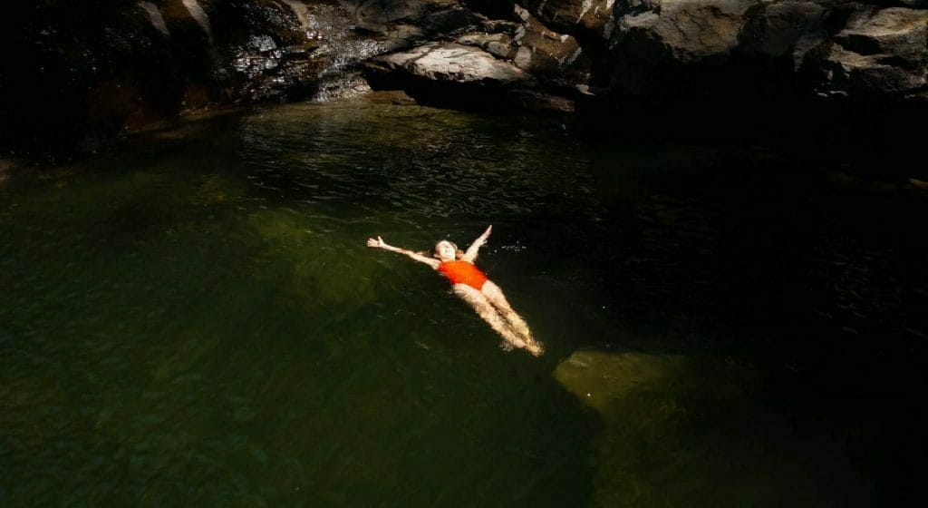 Find Victoria Falls For a Refreshing Swim All to Yourself, Matt Pearce, waterfall, swimming hole, woman, swim, float