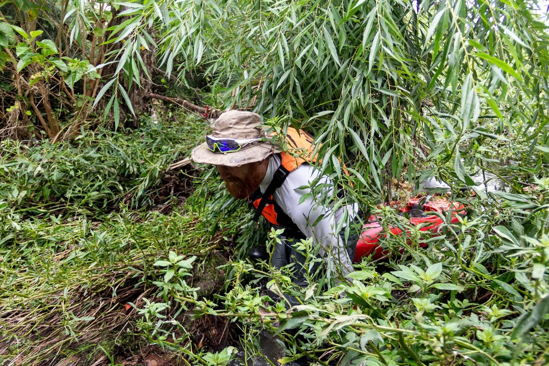 What the Heck Is Beau Miles Up to Now?, photo by Tim Ashelford, bad river, beau miles, kayak, peeking