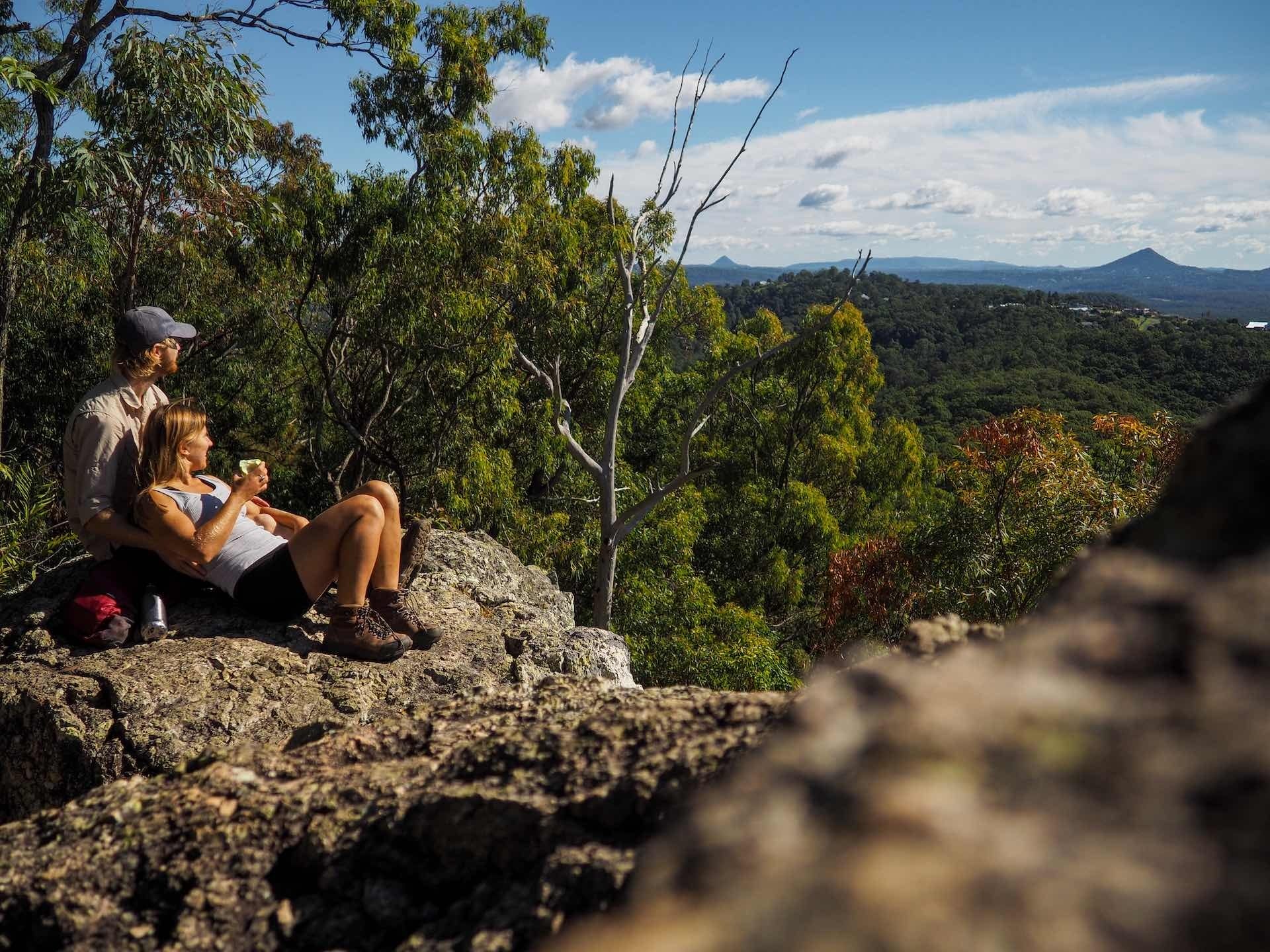 Sun, Surf, & Summits on This South East Queensland Road Trip, Ruby Woodruff, JUCY, Mt Ninderry, Glasshouse Mountains, couple, hike