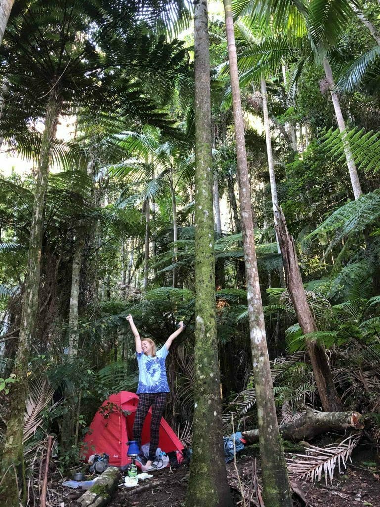 Off The Beaten (Historic Nightcap) Track – Byron Bay’s Best Hidden Hike, Alice Forrest, woman, stretch, camping, tent, rainforest, palms