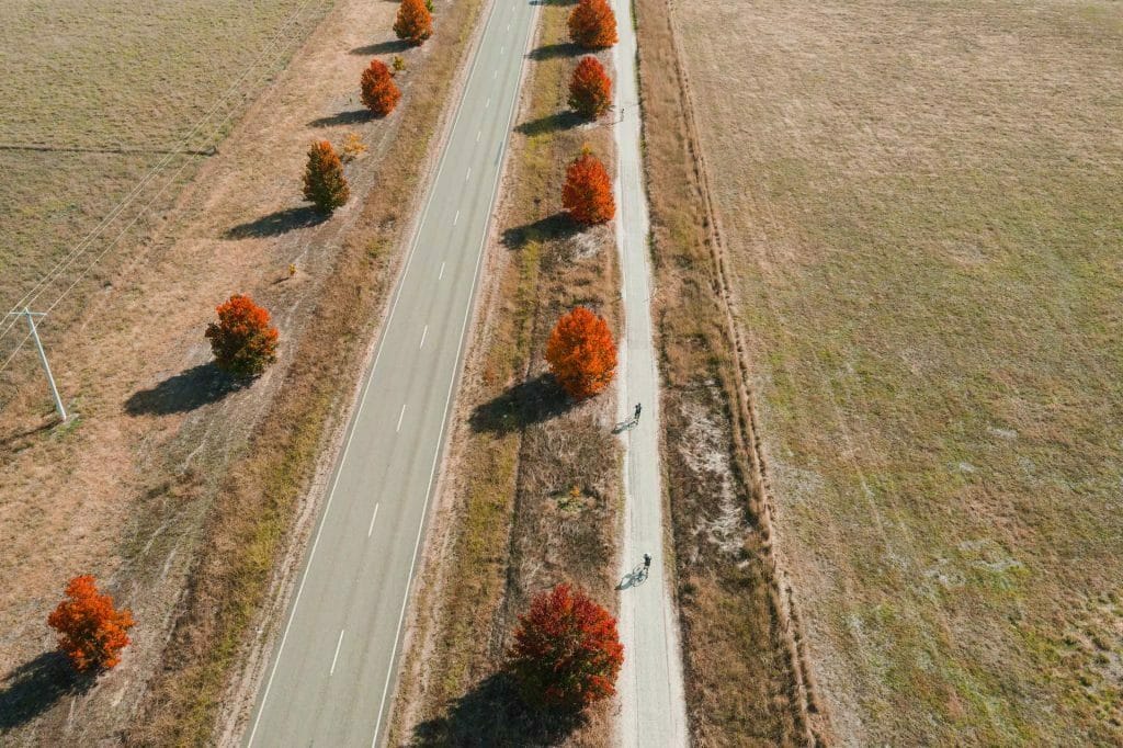 The Best Bike Riding Adventures Around Wangaratta, photo by Jono Tan, Wangaratta, Victoria, Rail Trail, drone shot, autumn leaves, bike riding, Milawa