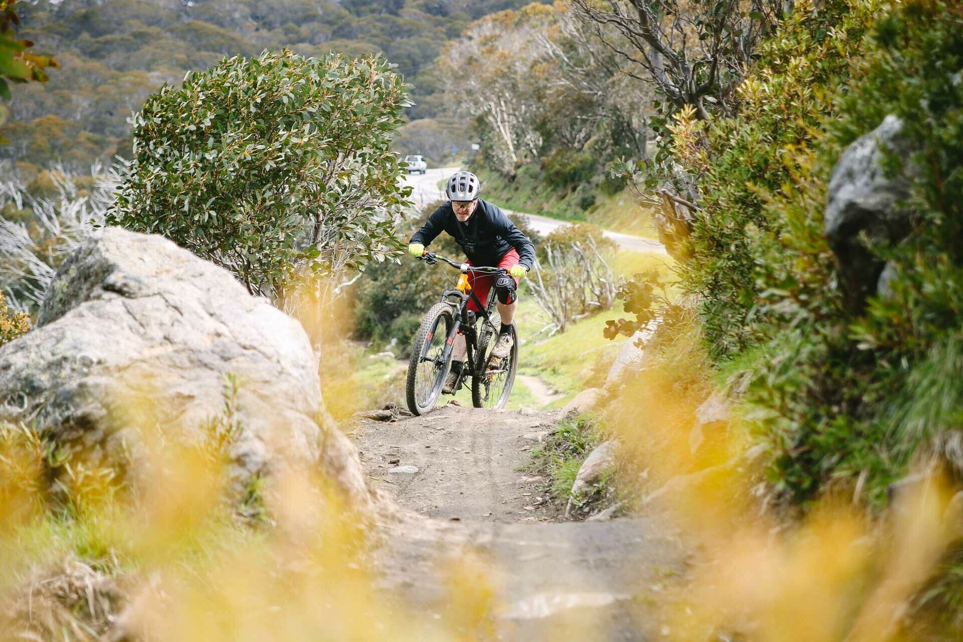 a rider climbs the trail, shot by Kale Munro, Tourism North East, Falls Creek, High Country, Victoria, mountain bike, cross country, cardio, hard work