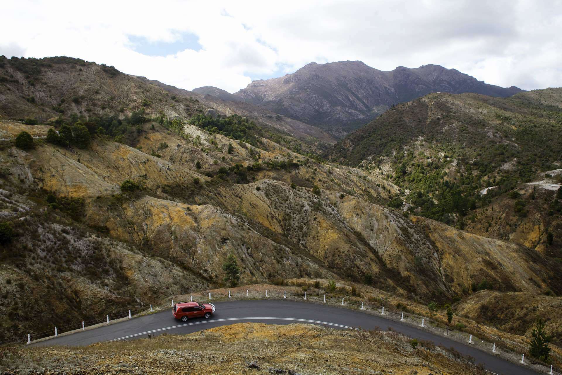 West Coast Tasmania: Home to Hiking, Biking & Rafting, Pete Harmsen, Queenstown, road trip, River Valley, hills