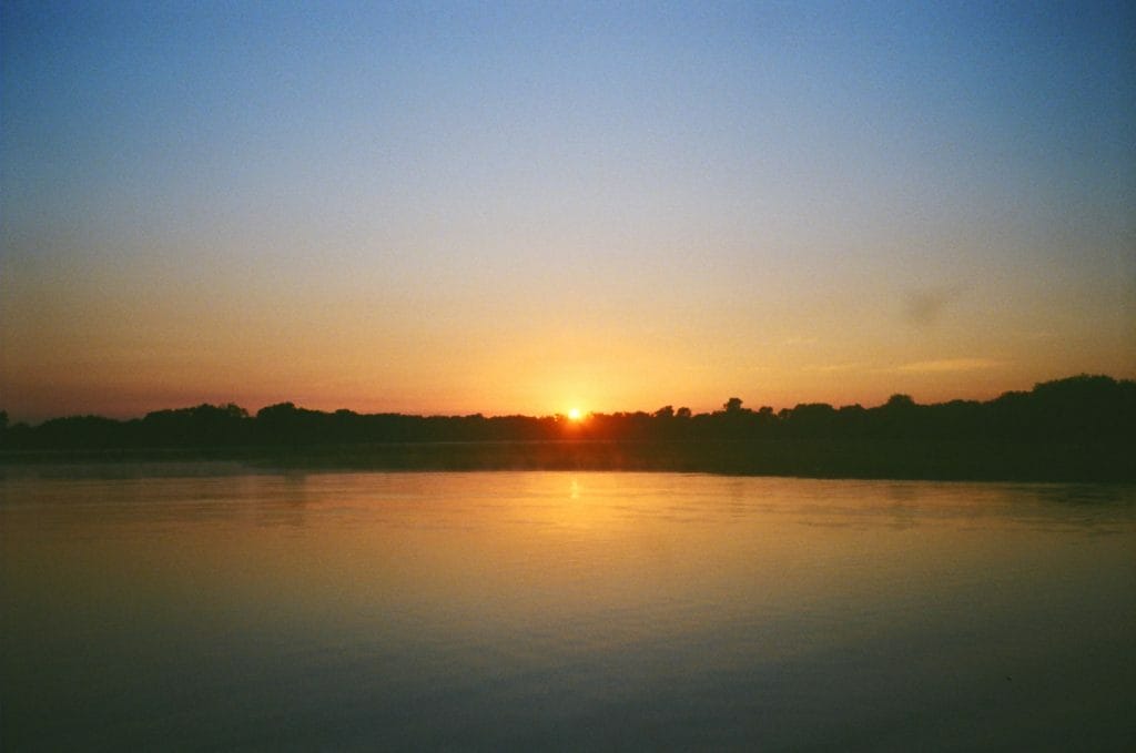 The Strangeness of Being Homesick in Your Own Country, Amy Fairall, sunrise, Kakadu National Park, billabong, film photo
