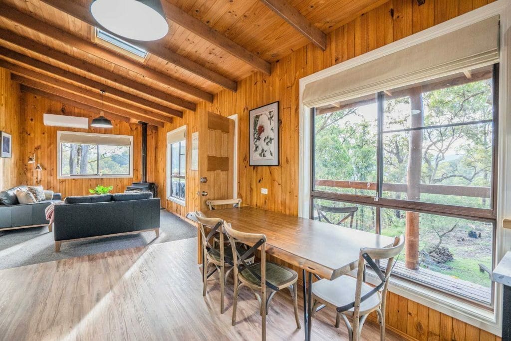 A dining room table in front of a window