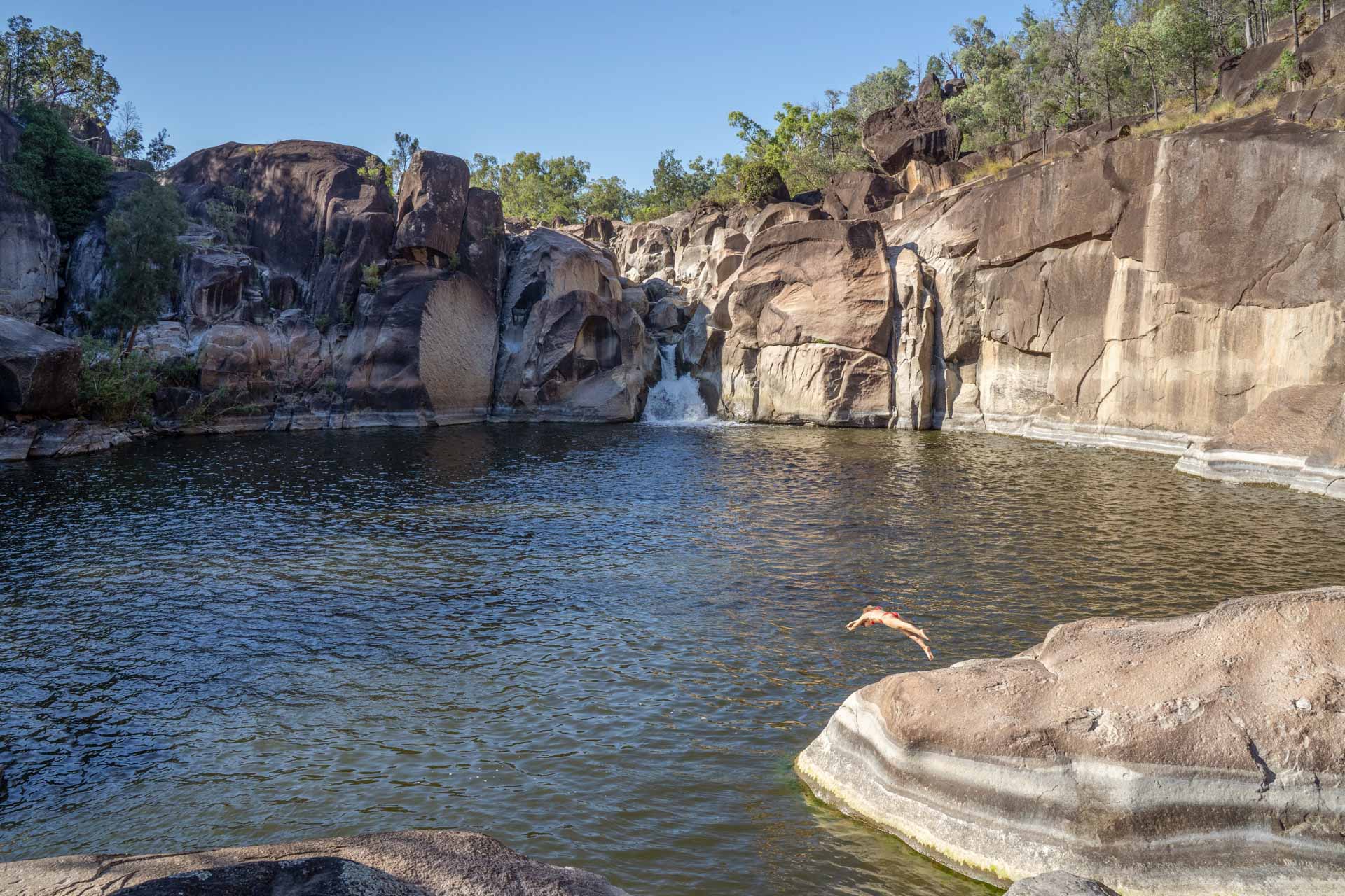 ARM002 Natural Wonders: A Guide to New England’s Best National Parks, Constance Allen, person diving into Macintyre Falls in Kwiambal national park