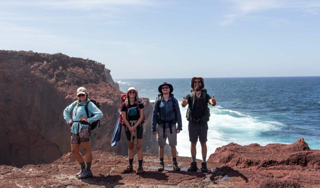 An Ode to Our Adventurous Friends, photo by Tim Ashelford, friends, hike, ocean, smile, thumbs up, happy