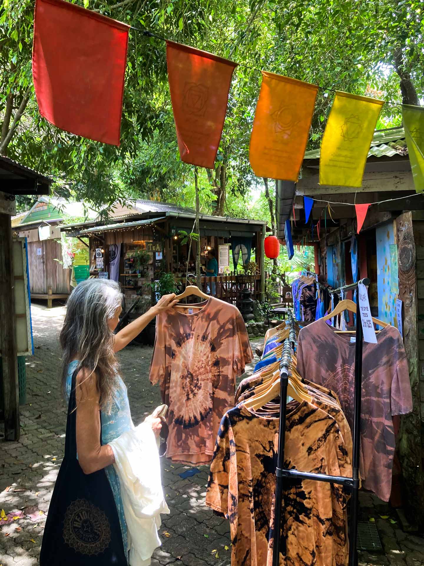 A Guide to the Rainforest Village of Kuranda, Delila Bevan-Zedanksy, looking at shirts, markets