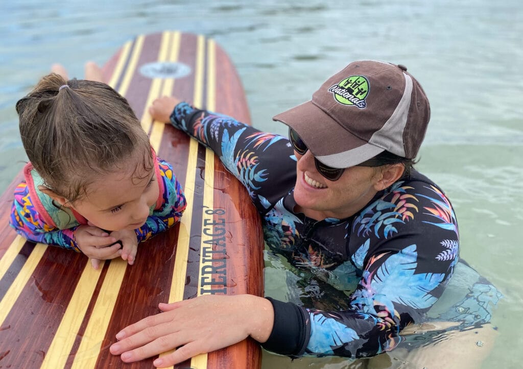 The Surfing Mums' Club – How One Mum is Finding Her Surfing Legs Again, Sarah Tayler, mum helping kid to surf