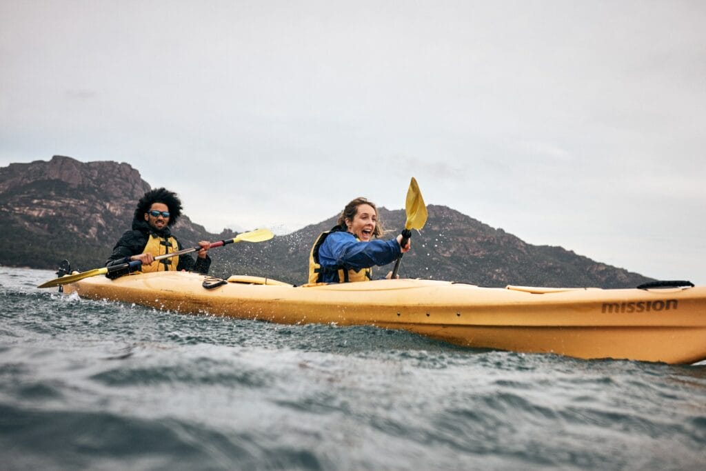 Paddle the Freycinet Peninsula – A Guide to Kayaking This Spectacular Tassie Coastline, Remi Chauvin, ocean, coast, kayak, couple, friends, go fast