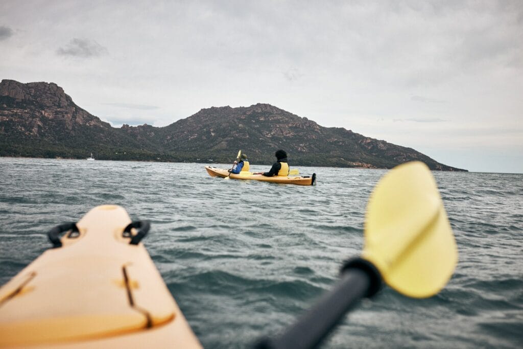 Paddle the Freycinet Peninsula – A Guide to Kayaking This Spectacular Tassie Coastline, Remi Chauvin, ocean, coast, kayak, couple, friends, paddle