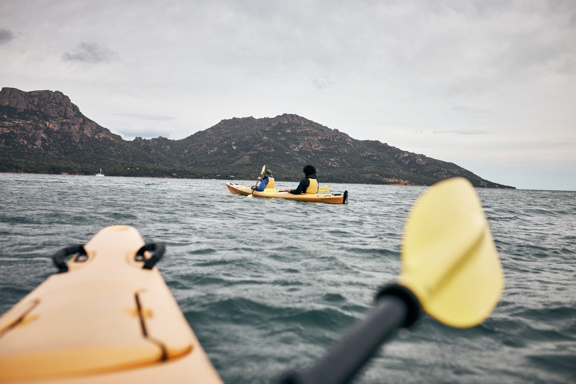 Paddle the Freycinet Peninsula – A Guide to Kayaking This Spectacular Tassie Coastline, Remi Chauvin, ocean, coast, kayak, couple, friends, paddle