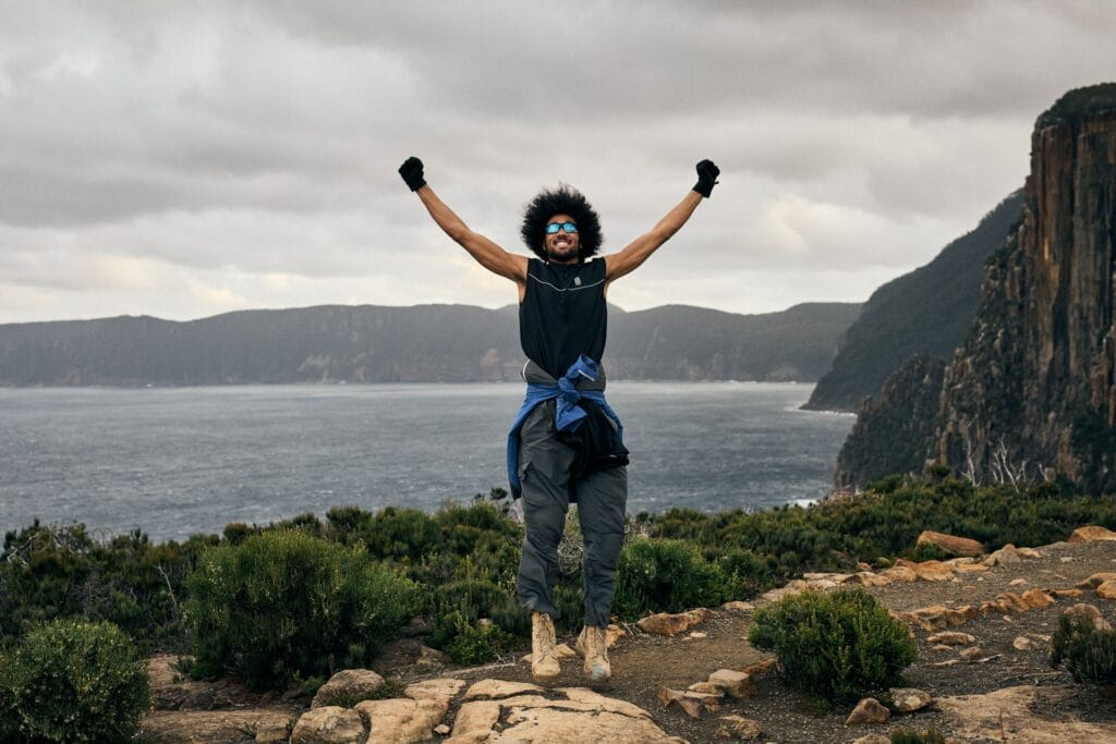 Cape Hauy – A Guide to Hiking This Jaw-Dropping Tassie Coastline, Remi Chauvin, hiking, Tasmania, yay, jump, happy, cliffs