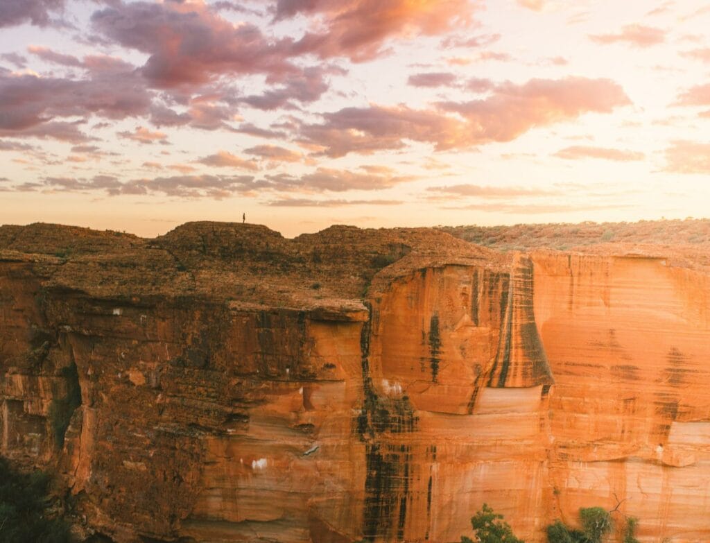 The Red Centre Light Trail is the New Bright Way to See Central Australia, photo by Tourism NT/Mitchell Cox, Kings Canyon, sunrise, cliff