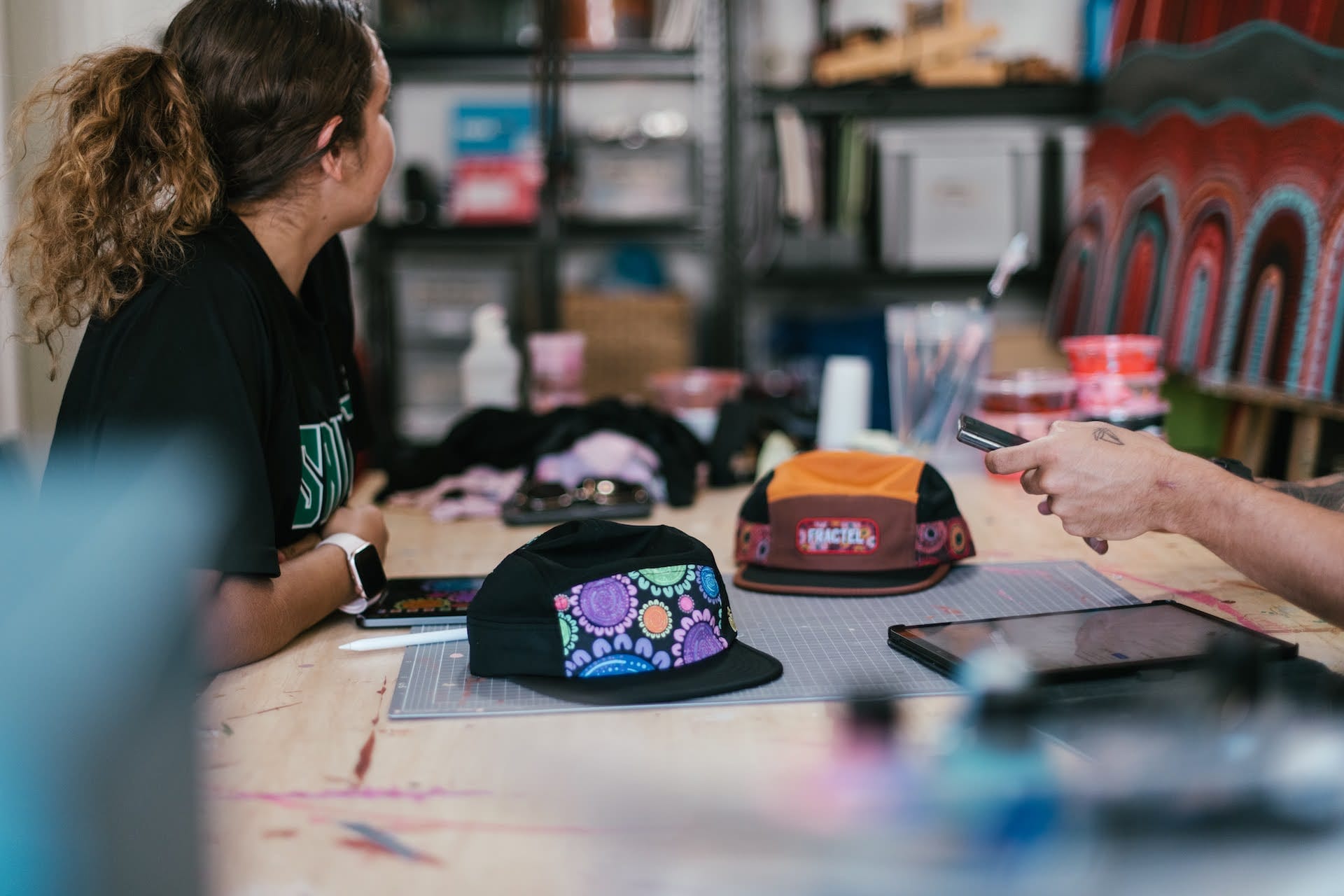 Fractel just dropped a NAIDOC week collection, Provided by Fractel, Limited Edition Hats at the table