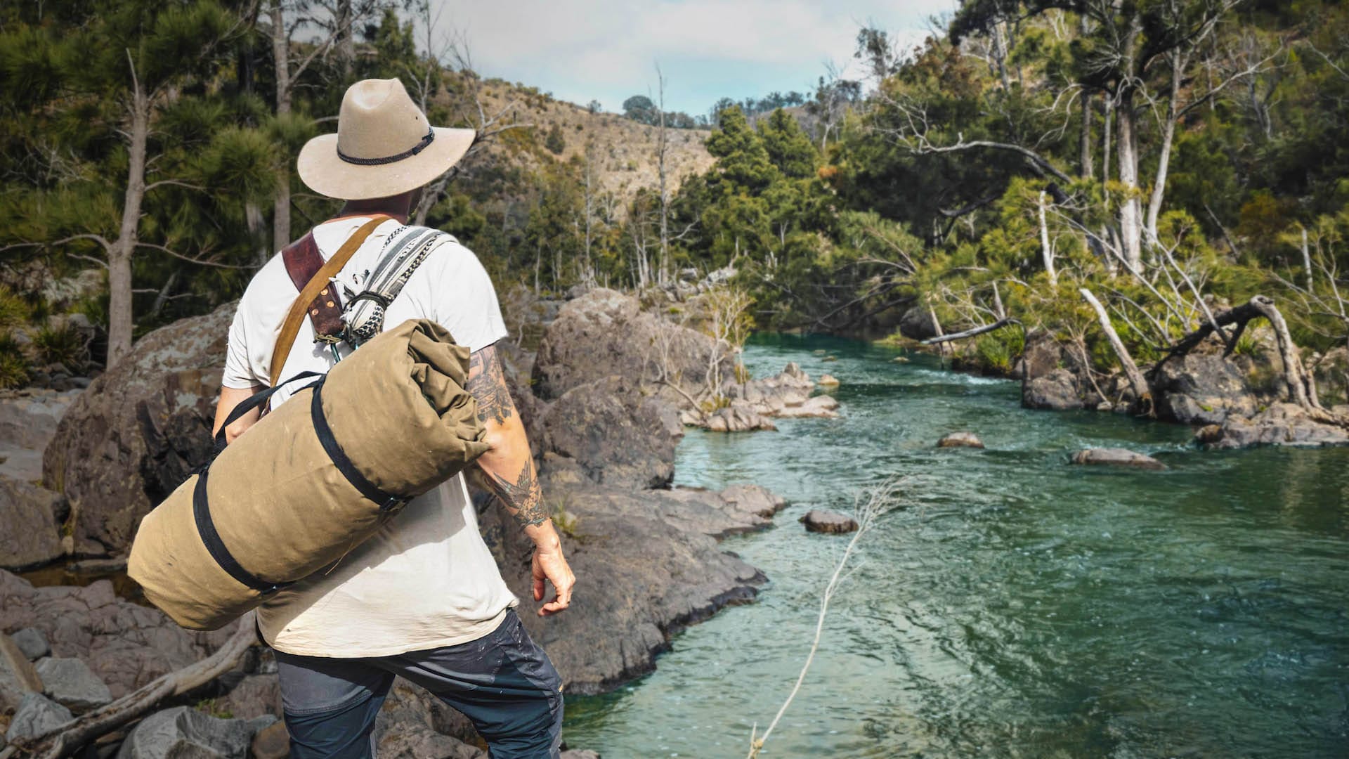 Wild Camping with Respect - Scotty's Gone Walkabout – We Are Explorers Podcast Ep 9, Scott Williams by a river with swag