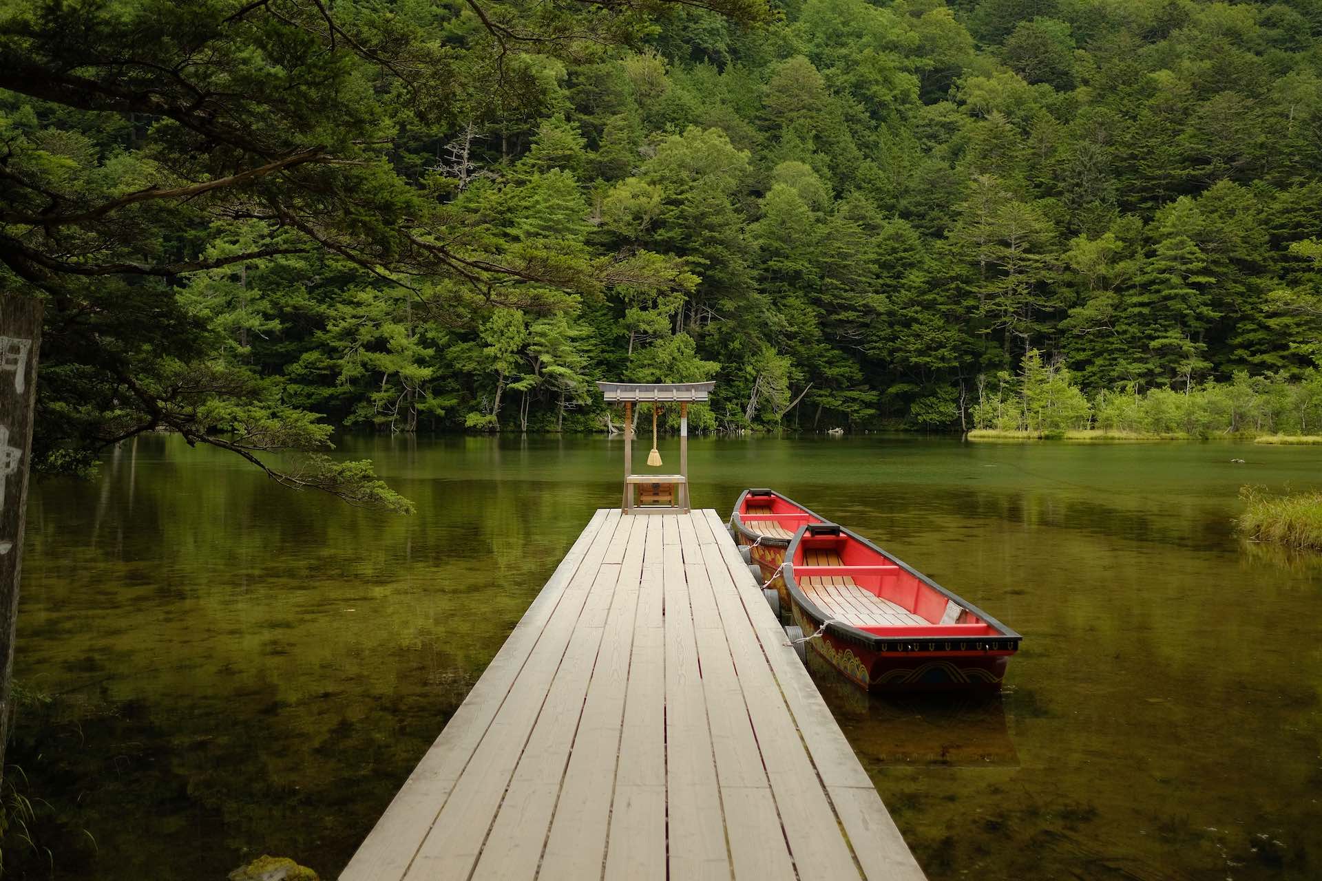 Nagano – A Guide to the Foothills of the Japan Alps, Lucid, LUC001, Lucy Dayman, Myojinike, Kamikochi, Nagano, Japan, boat on lake, jetty, Photo Credit: Trevor Paxton, Unsplash