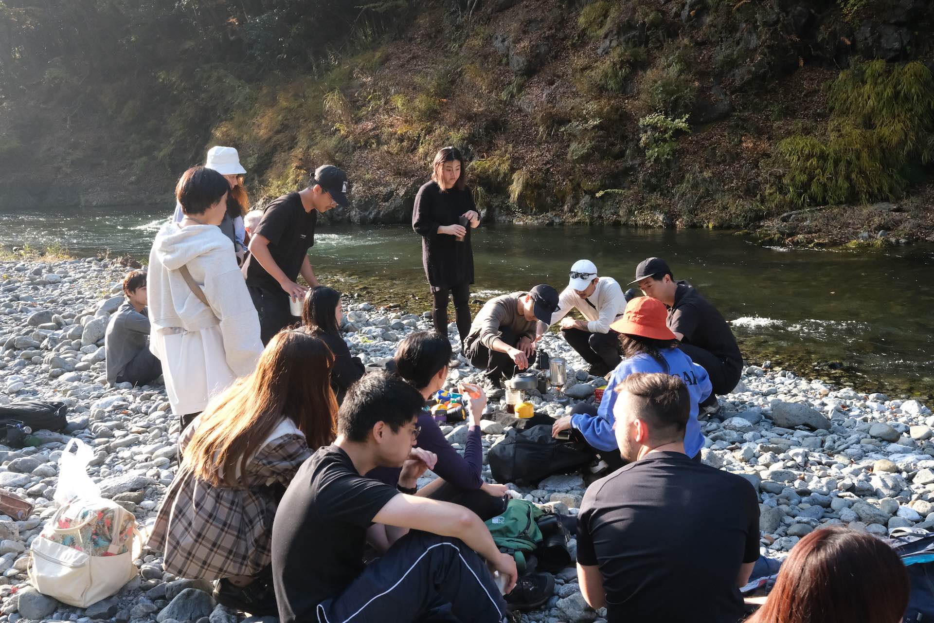 Chichibu-Tama-Kai National Park: 3 Stunning Hikes Near Tokyo, Japan, Lucy Dayman, Lucid, LUC001, Okutama’s Otama Walking Trail, rest stop, hikers on riverbed, snack break, hiking group, lunch break,