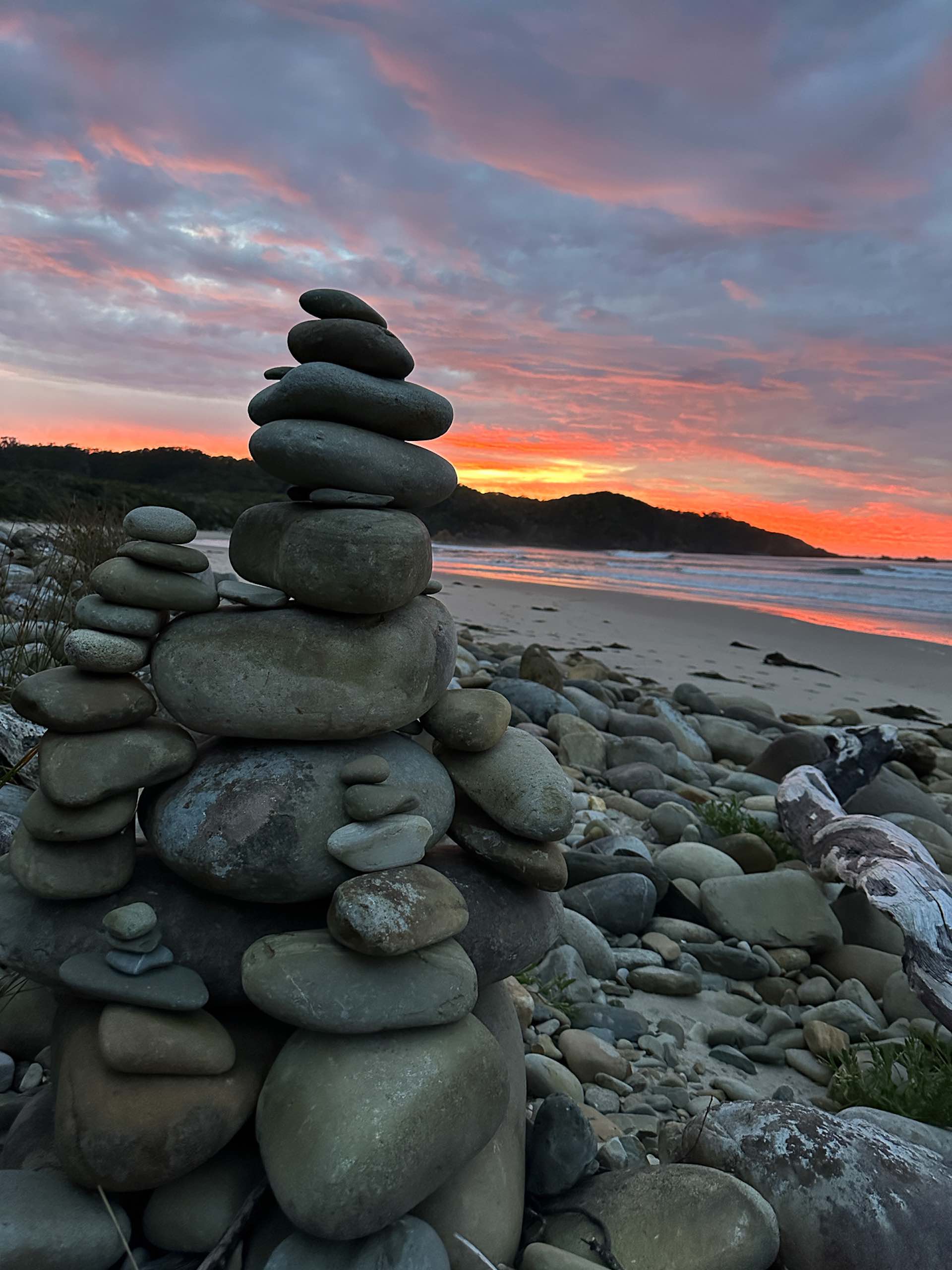 South Coast Track – 5 Days Hiking in Tassie’s Remote Southwest National Park, Alissa Ward, Tasmania, cairn, rock cairn, sunset, rocky beach