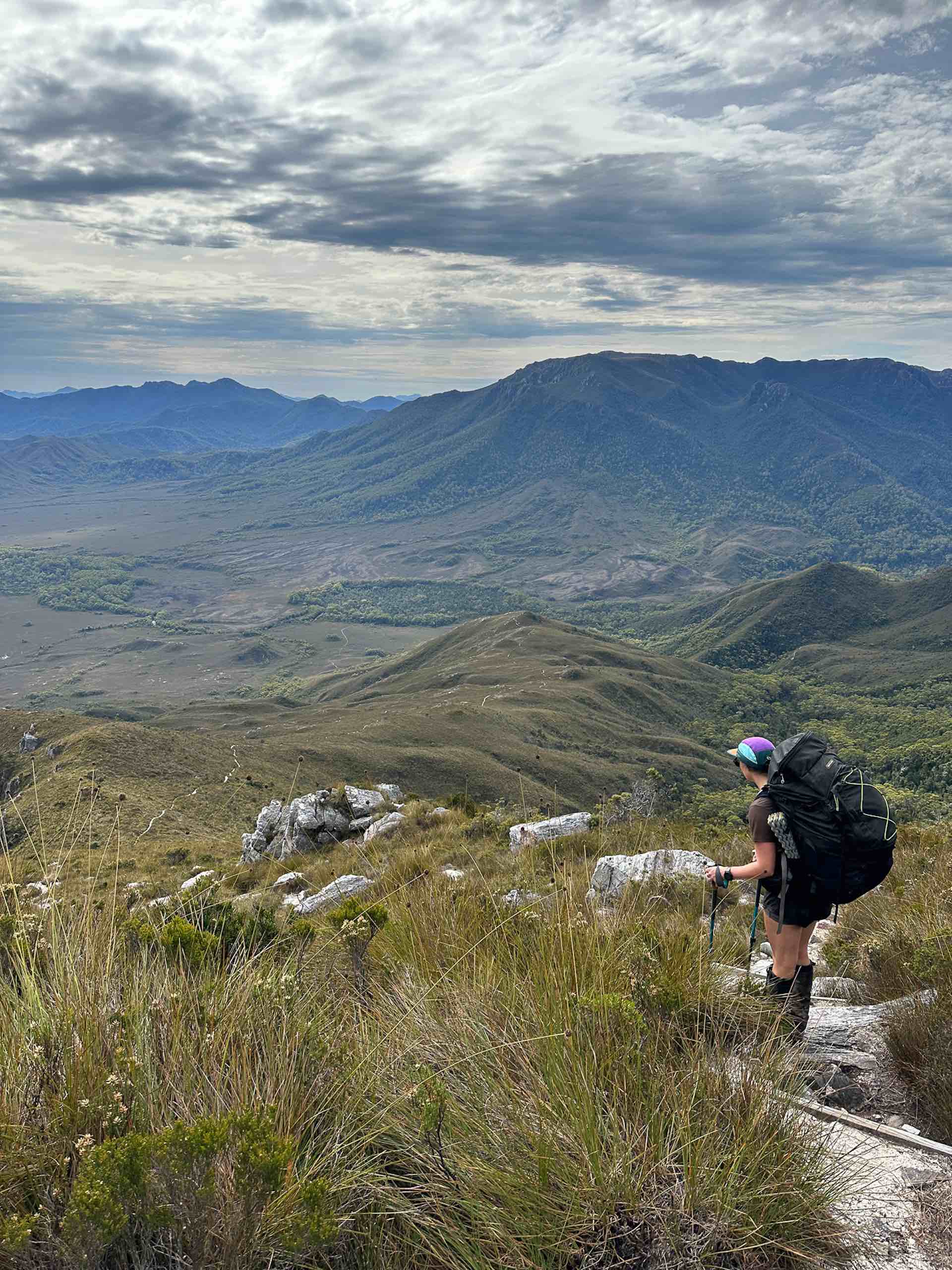 South Coast Track – 5 Days Hiking in Tassie’s Remote Southwest National Park, Alissa Ward, Tasmania, View of mountain range, hiker enjoying view,