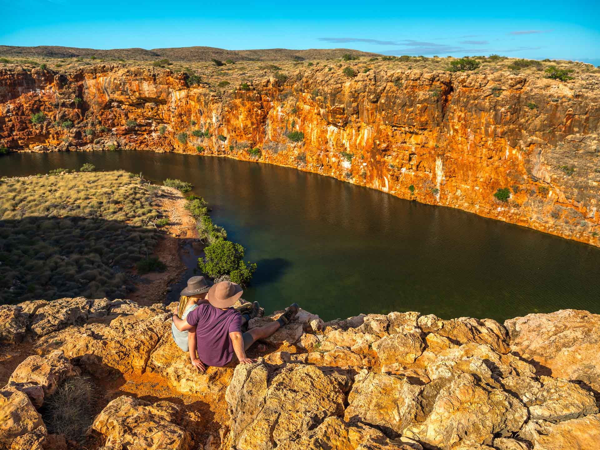 4 WA National Parks you should put on your radar, Julia D'Orazio, Image Credit Tourism WA, Yardie Creek, Couple, people enjoying view, Cape Range National Park