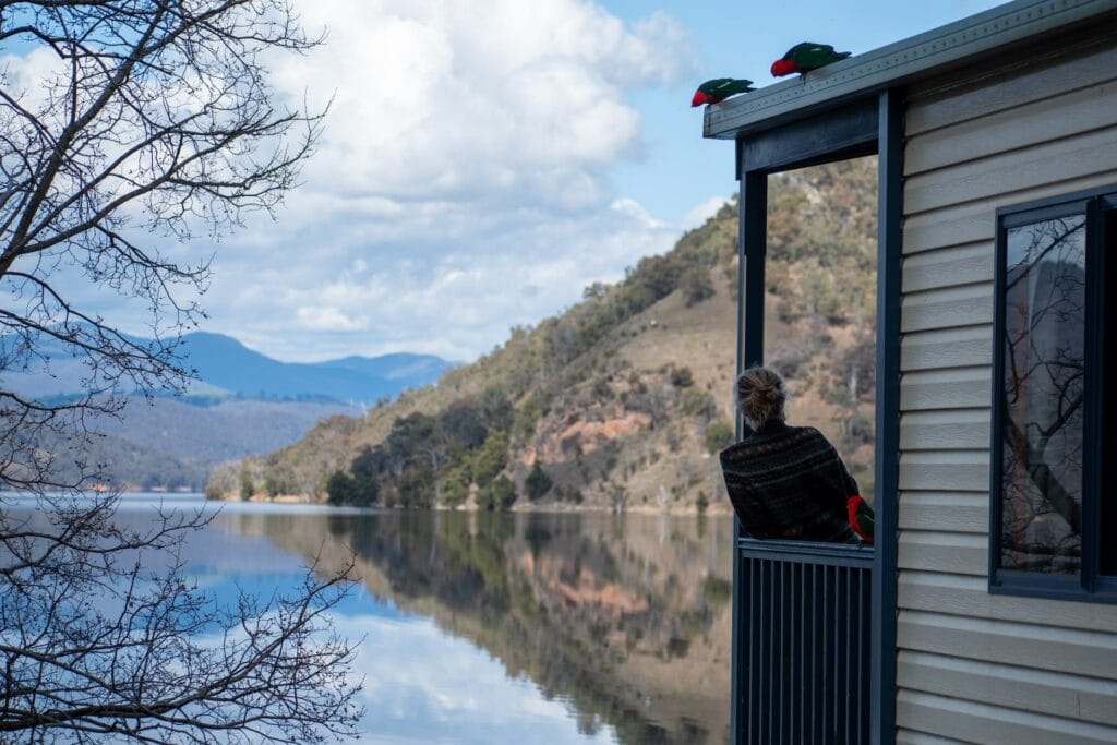 8 Lesser-Known Destinations in NSW and Why You Need To Visit Them, Eva Davis-Boermans, Lake, reflections, woman leaning on balcony, Burrinjuck, NSW,
