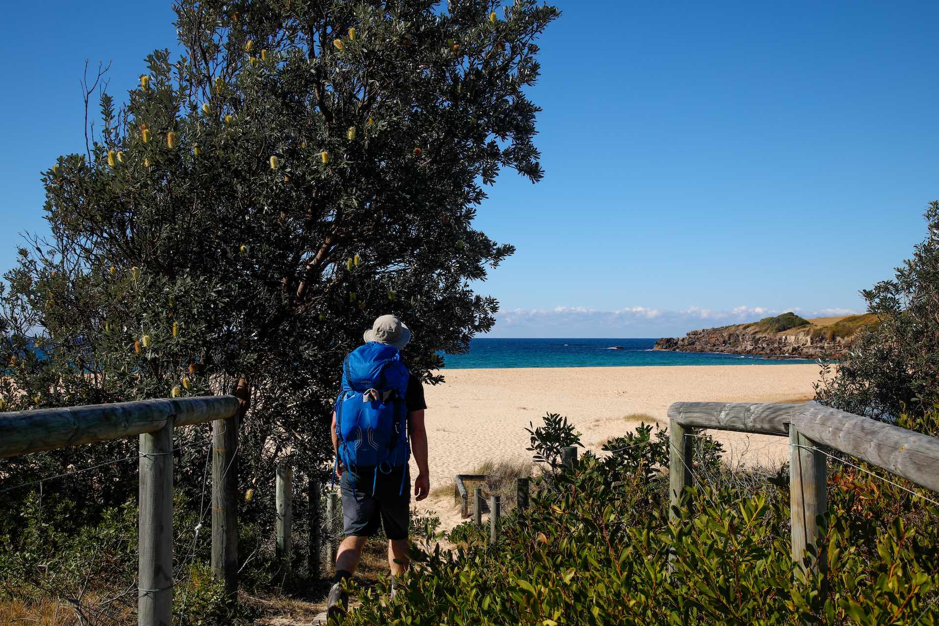 Hiking the Wharf to Wharf Walk From Tathra to Merimbula, Mattie Gould, Sapphire Coast, NSW, hiker on beach