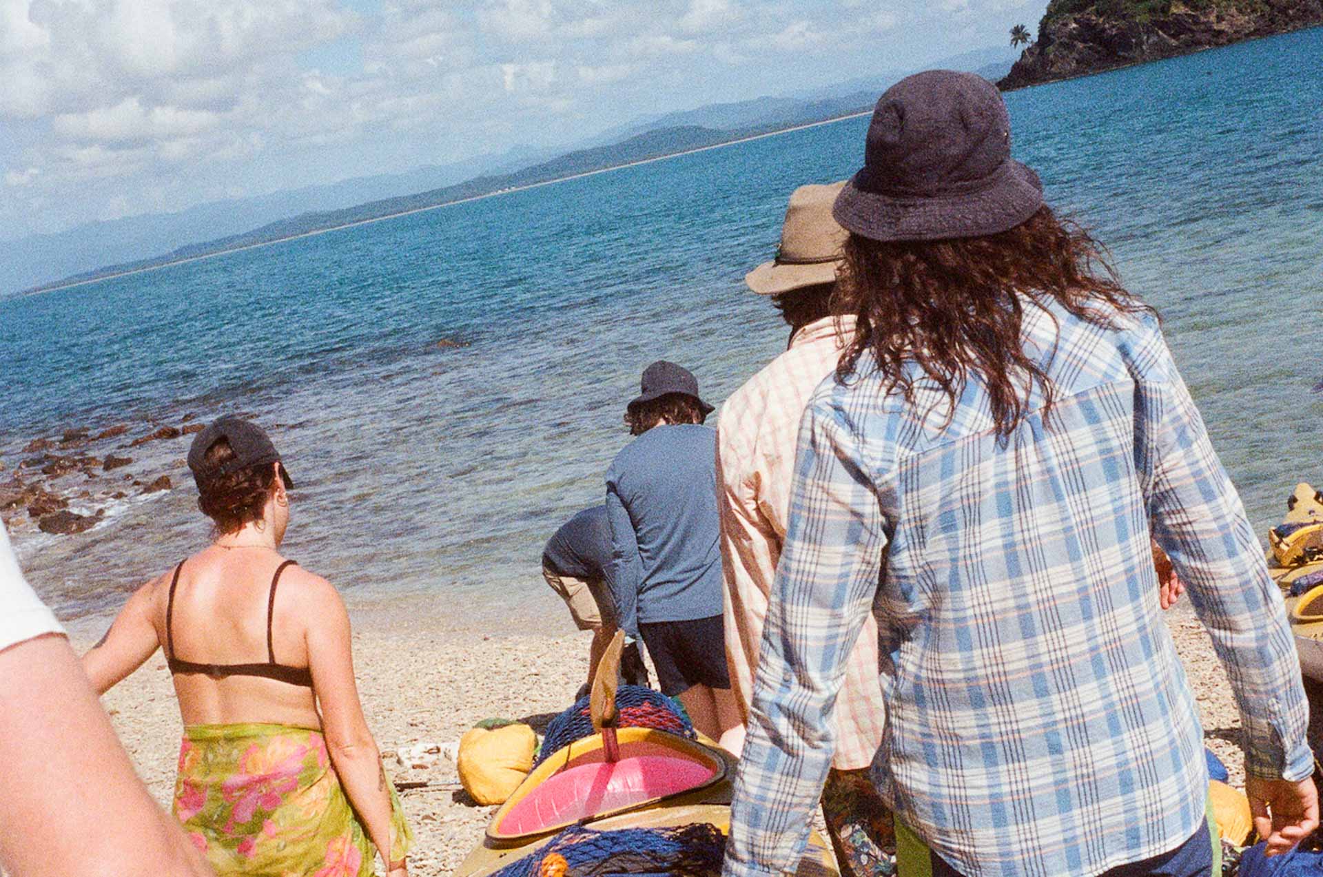 kayak trip, jack brookes, film, team lifting a sea kayak, we are explorers, queensland, crop