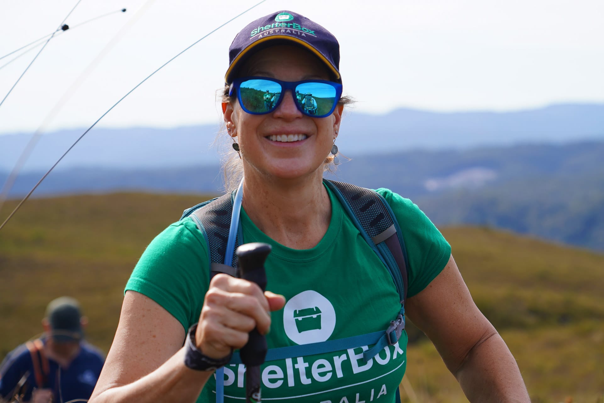 I Spent 5 Days With Strangers Trekking in takayna For Charity, Cathy Young, Mount Donaldson Walk, Tasmania, smiling hiker, sunnies, Shelterbox