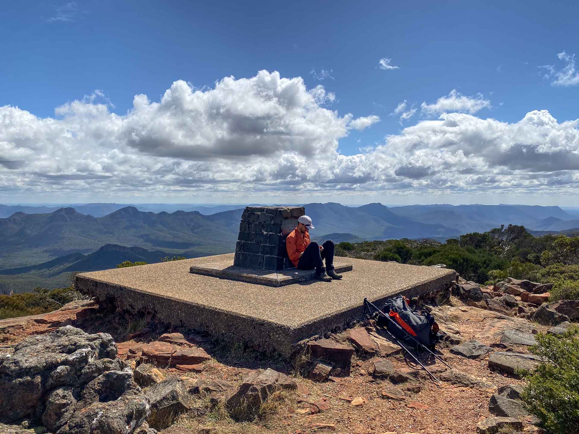 Major Mitchell Plateau – Hike the Best of the Grampians Over 3 Days, Hiking, Multi-Day Hike, Victoria, hiker sitting down on top Grampians mountain peak
