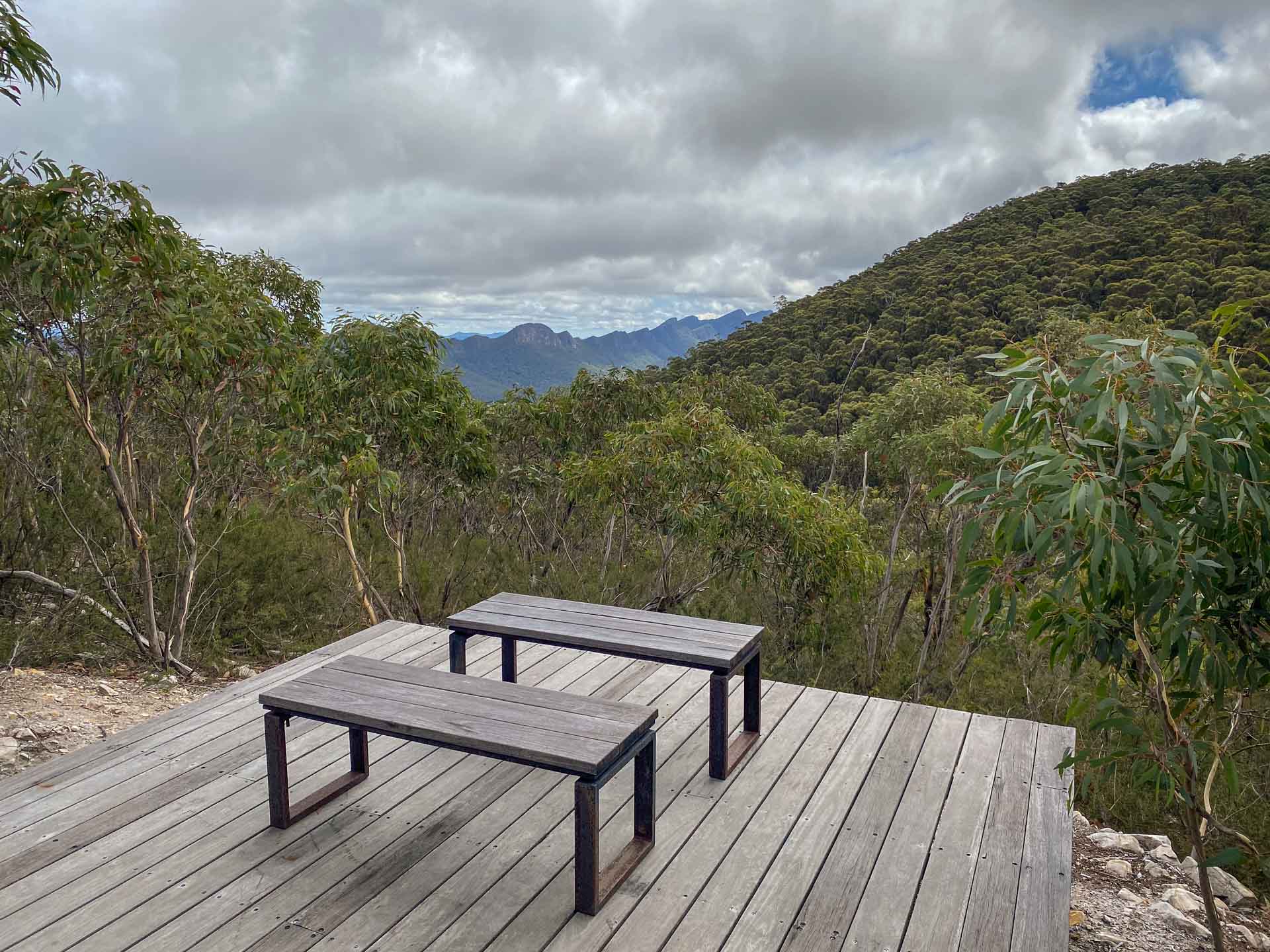 Major Mitchell Plateau – Hike the Best of the Grampians Over 3 Days, Hiking, Multi-Day Hike, Victoria, table and chairs on a platform overlooking mountain range