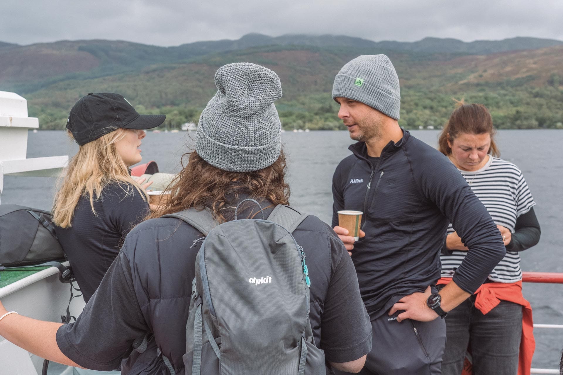 Loch Lomond: Where The Highlands Meet The Lowlands, scotland, scotland hiking, lochs of scotland, loch lomond, group of people on back of loch lomond cruise drinking tea