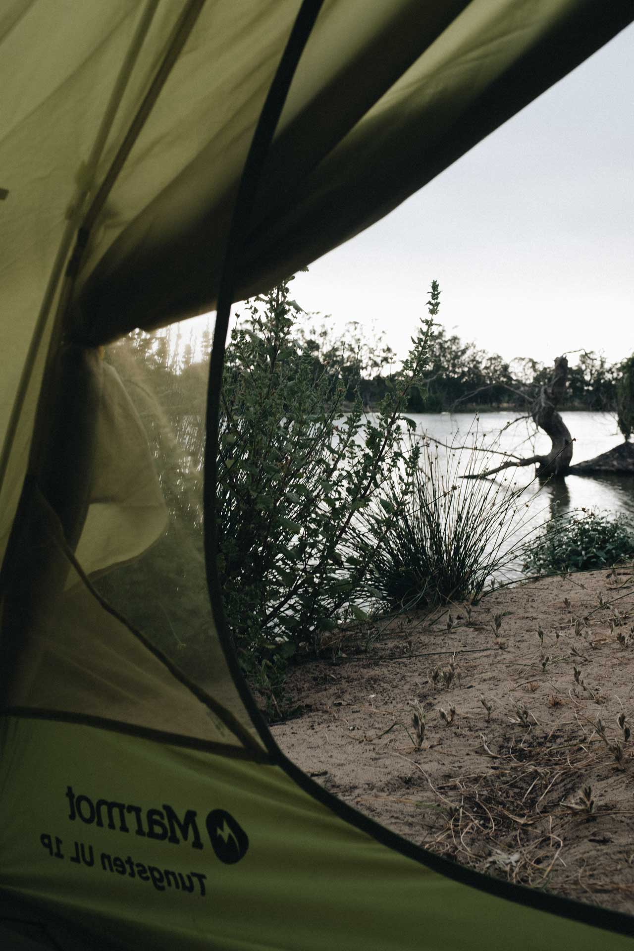 I Went Back To Basics On My Murray River Bikepacking Trip – Here’s What I Learnt, bikepacking, camping, tent, view from green marmot tent looking onto a river