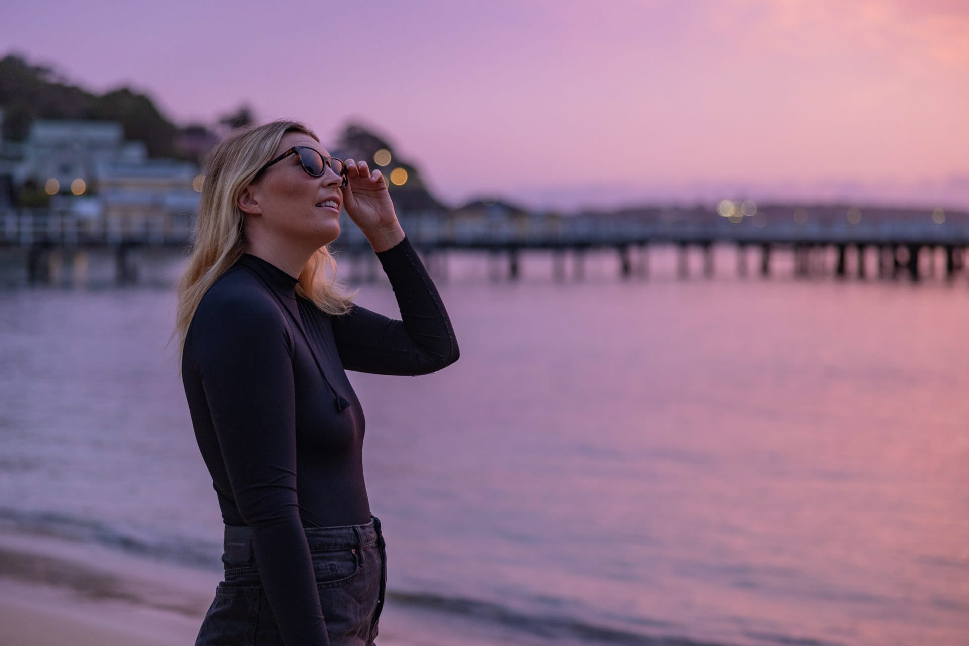 Meet Grumpy Turtle Films – The Company Telling Underwater Stories in The Name Of Conservation, conservation, photography, marine life, lady in wetsuit looking upwards with pink sunset in the background, sponsored, costa del mar, costa