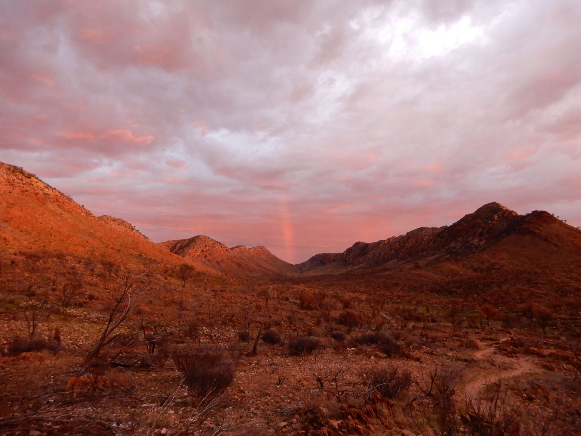 The ‘Big 3’ Hikes of the NT: How Do They Compare?, hiking, northern territory, larapinta trail, mountains, indigenous culture, multi-day hike, rainbow above the mountain ranges on the larapinta trail