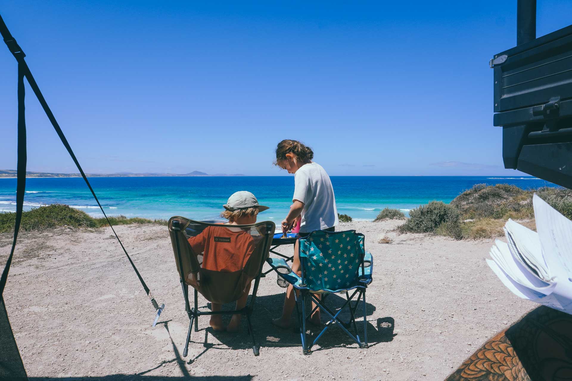 50 Lessons From a Road Trip Across Australia, journal, camping, roadtrip, children eating food at camp overlooking the ocean