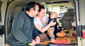 We Road Tripped From Sydney to Perth With a Three-Month-Old, roadtrip, van life, parents smiling at their baby in their van