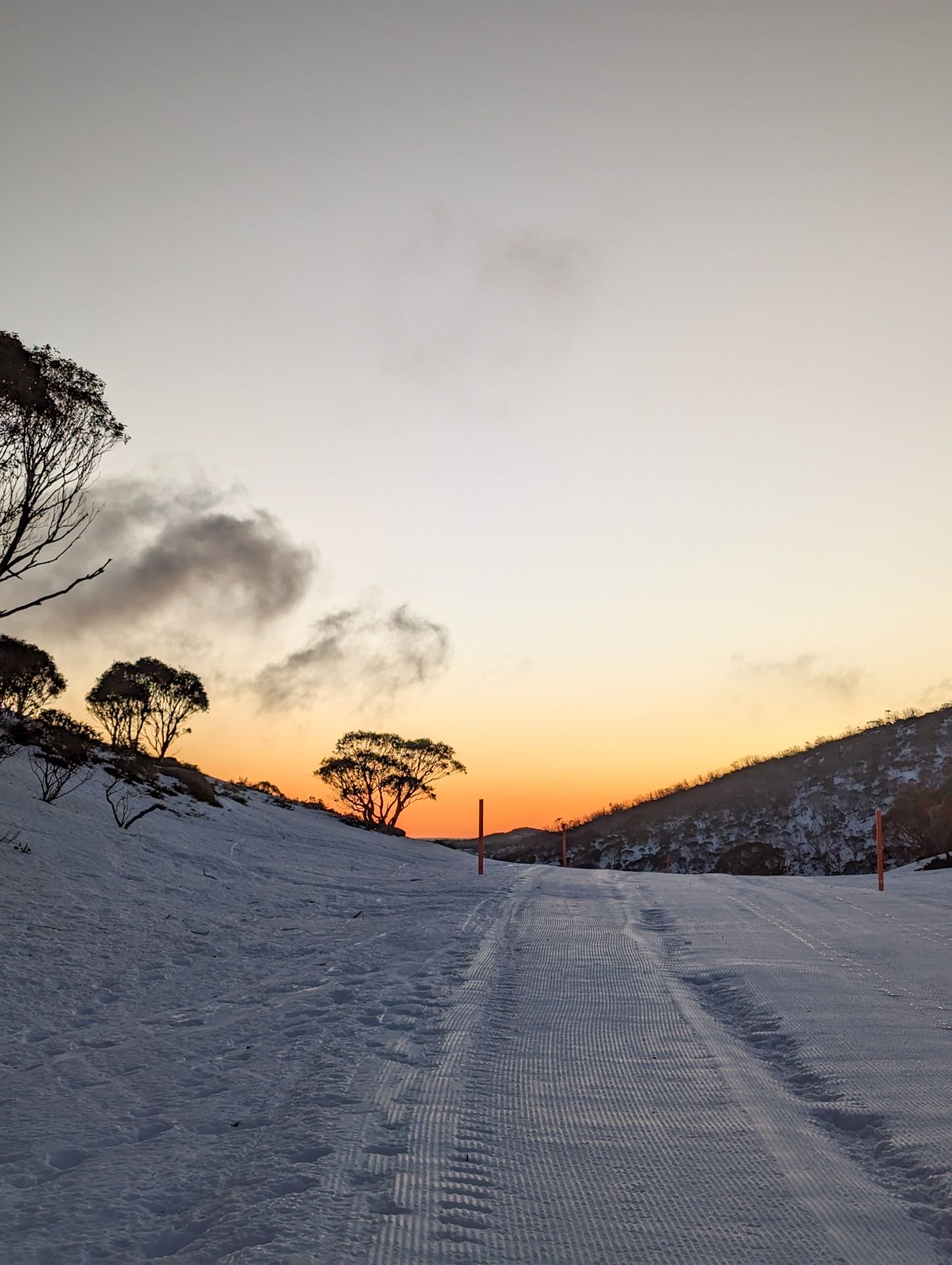 This Guy is Summiting the Highest Point in All 16 of Australia's States & Territories, william crompton, hiking, australian mountains, sun rise at perisher on the trail up mount kosciuszko