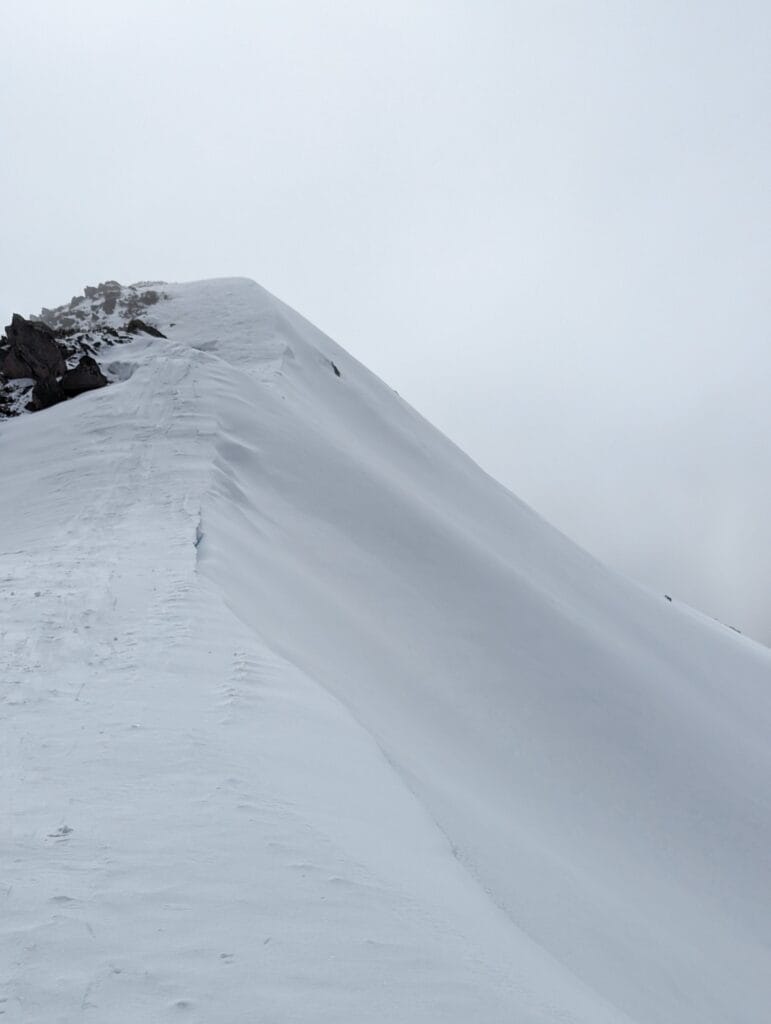 This Guy is Summiting the Highest Point in All 16 of Australia's States & Territories, william crompton, hiking, australian mountains, snow covered slope on Mt bogong