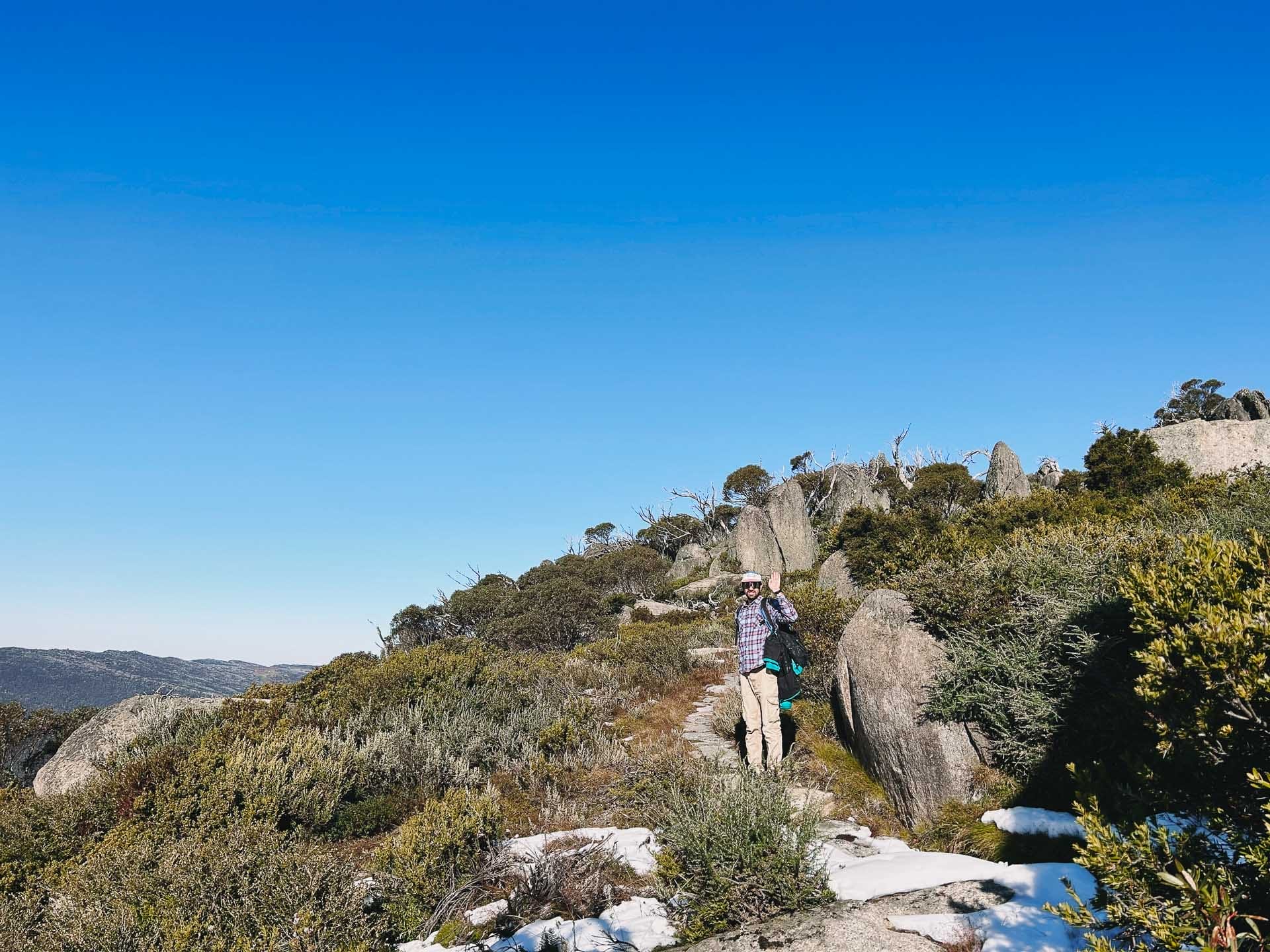 Charlotte Pass to Perisher Walk – Hiking the Newest Stage of the Snowies Alpine Walk in Kosciuszko National Park, nsw hikes, Photo by Kate Donald, alpine, back country, day hike, hiker on rocky trail at kosciuszko