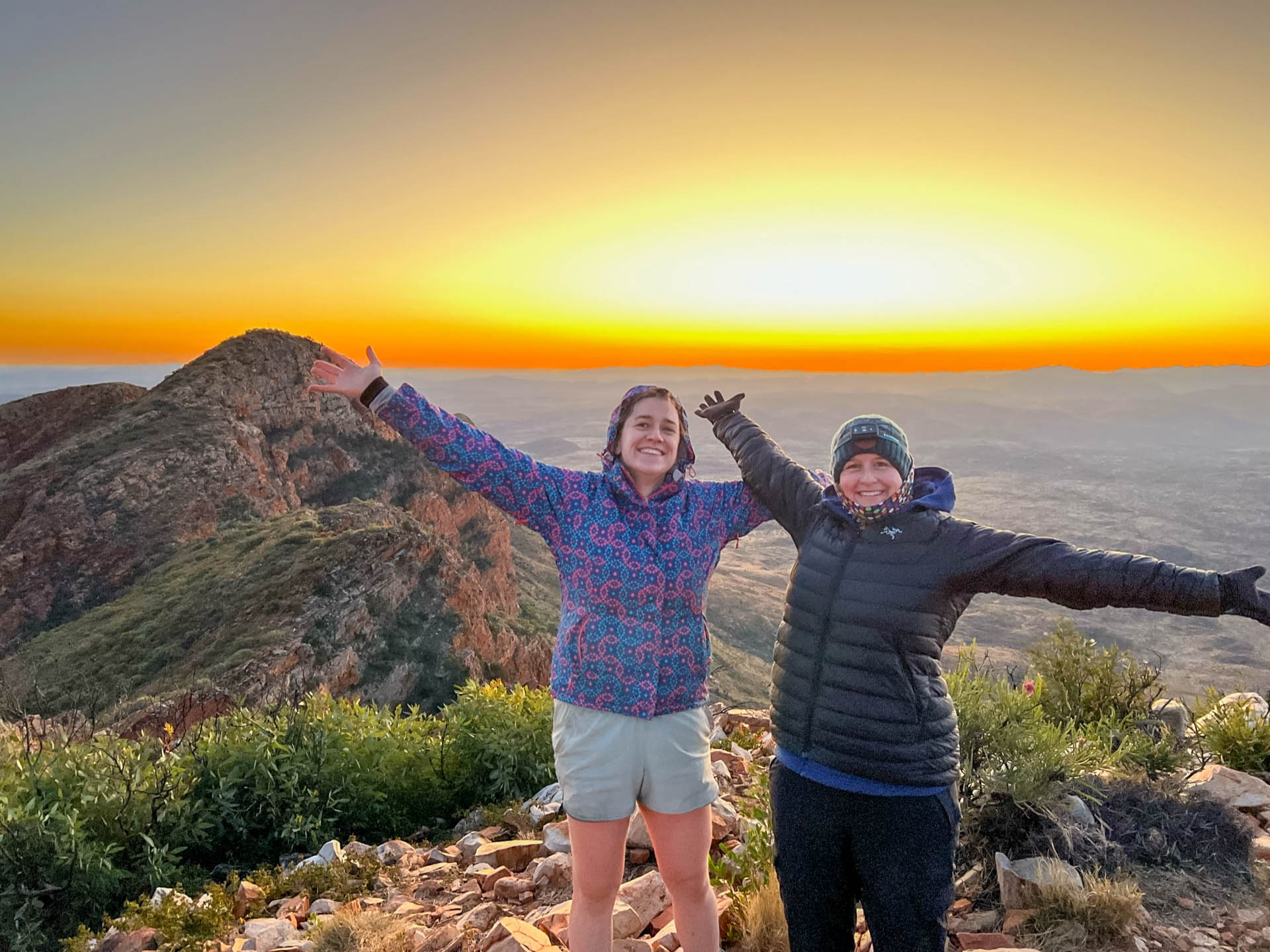 I Hiked the Larapinta Trail Solo With a 28kg Pack & Wouldn't Change a Thing, bree townsend, larapinta trail, northern territory hike, solo hiking, bree townsend and her friend anna posing on top of mount sonder on the larapinta trail