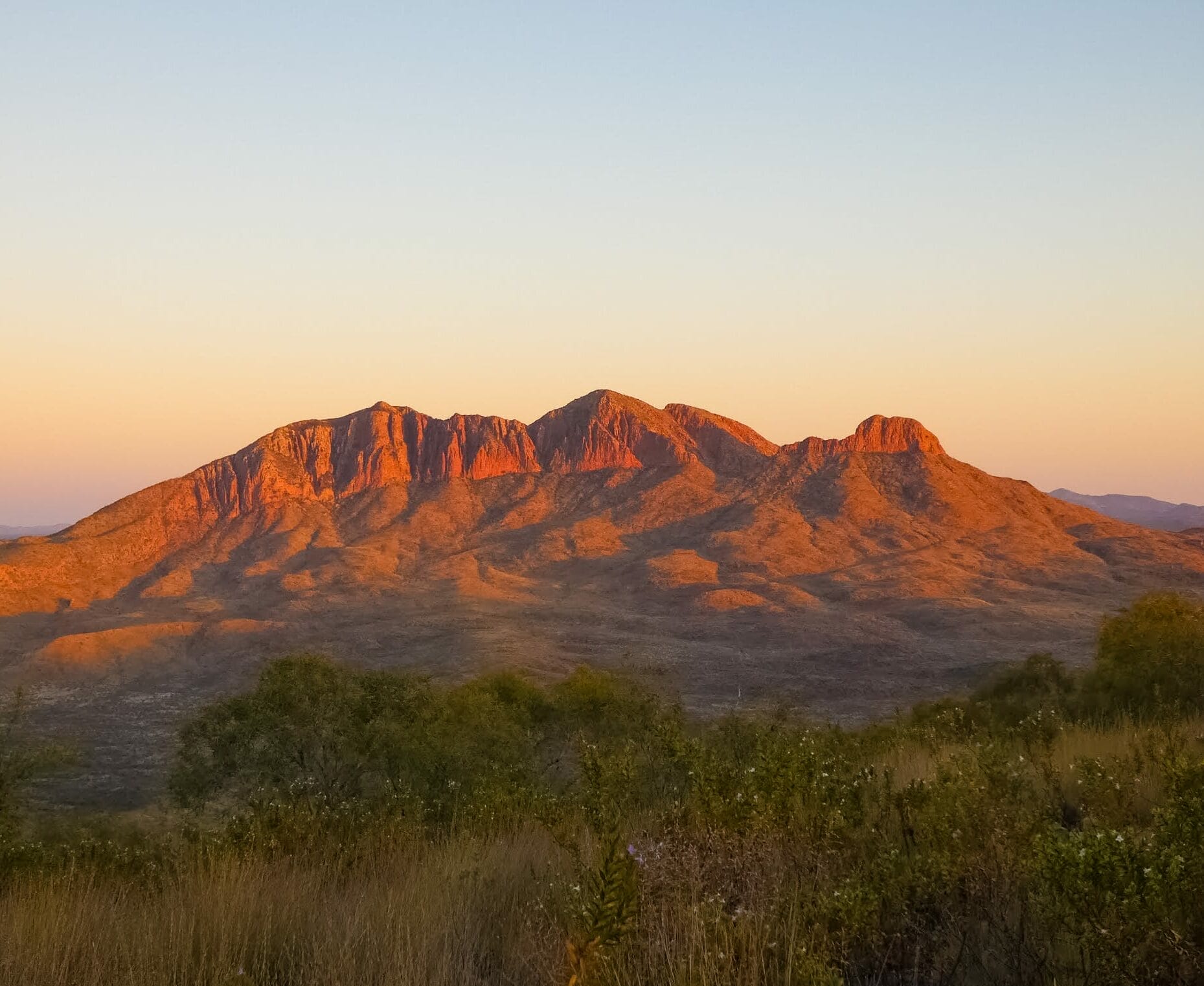 I Hiked the Larapinta Trail Solo With a 28kg Pack & Wouldn't Change a Thing, declan moyland, larapinta trail, northern territory hike, solo hiking, sunset time looking at mount sounder from the larapinta trail in australia