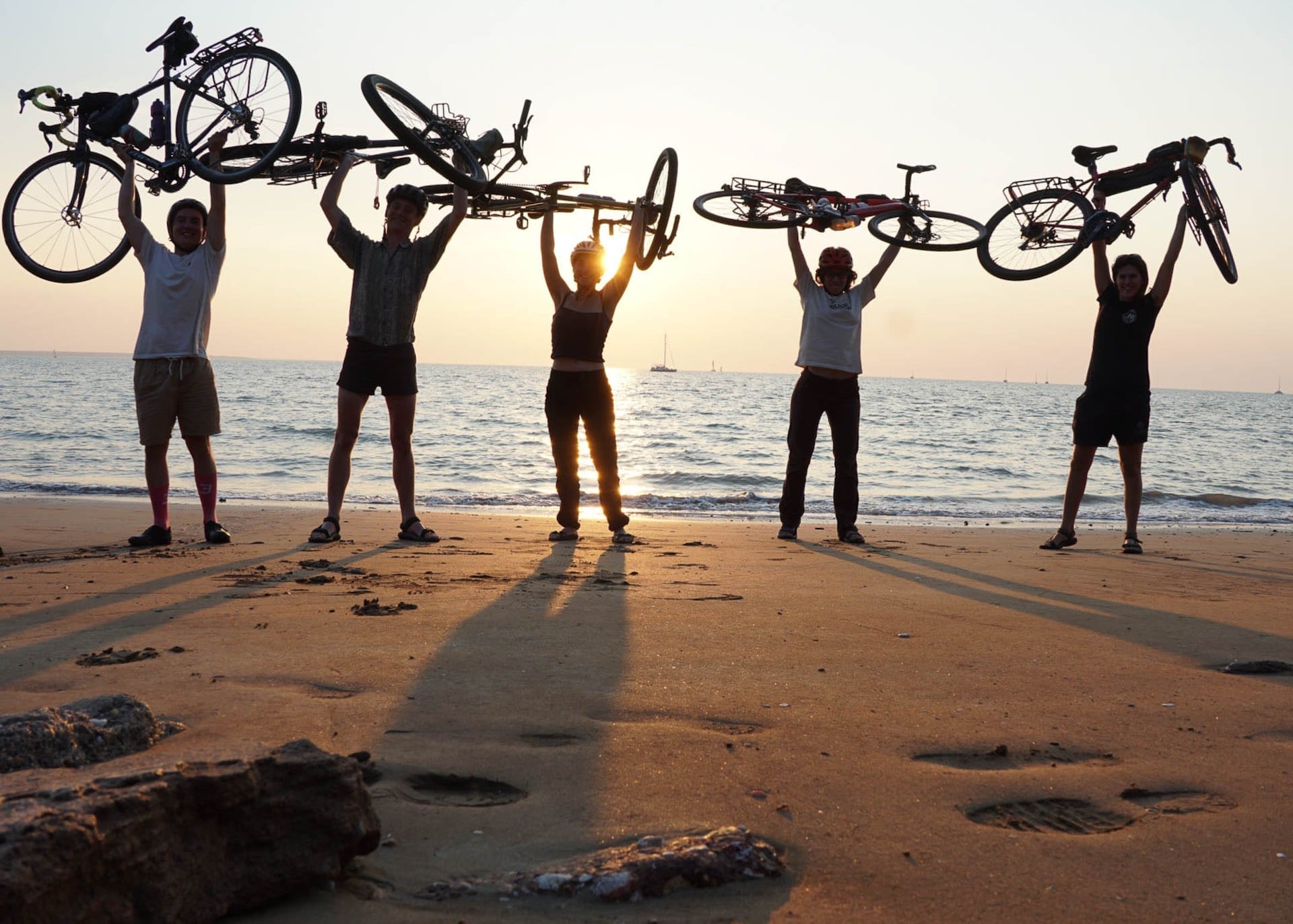 Our First Bikepacking Trip Was Brisbane To Darwin in 42 Days, Elijah Benjamin-Wood & Georgia Forster. Photos by @challengeandbeauty .Northern Territory, sunset, friends, cyclists, celebrate