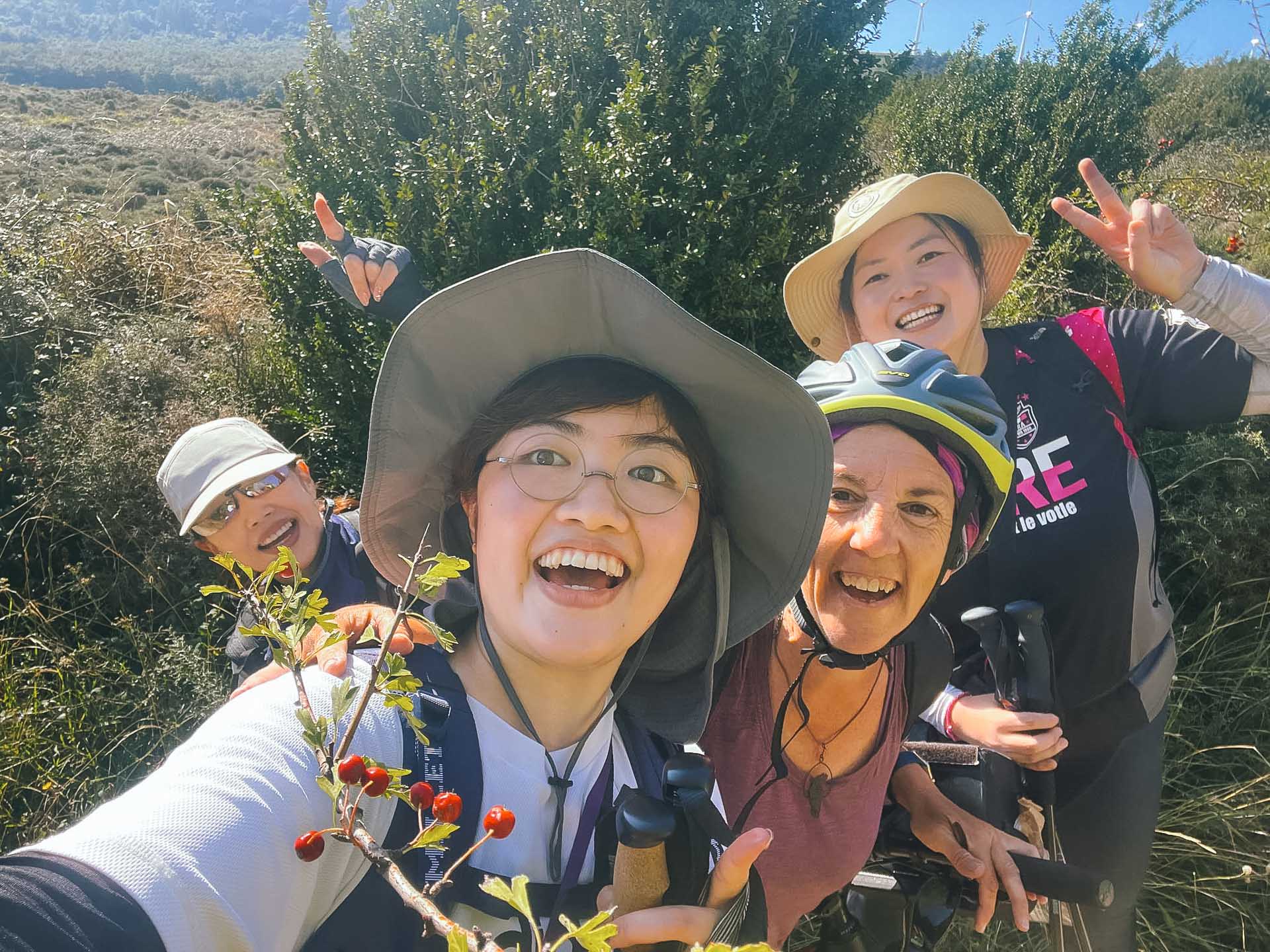 Paralyzed From the Neck Down to Cycling the Camino de Santiago: Meet the Unstoppable Cate Green, Photos by Cate Green, Q&A, MS, cycling, bike, bikepacking, camino de santiago, pilgrimage, four people smiling posing for a photo on the camino de santiago